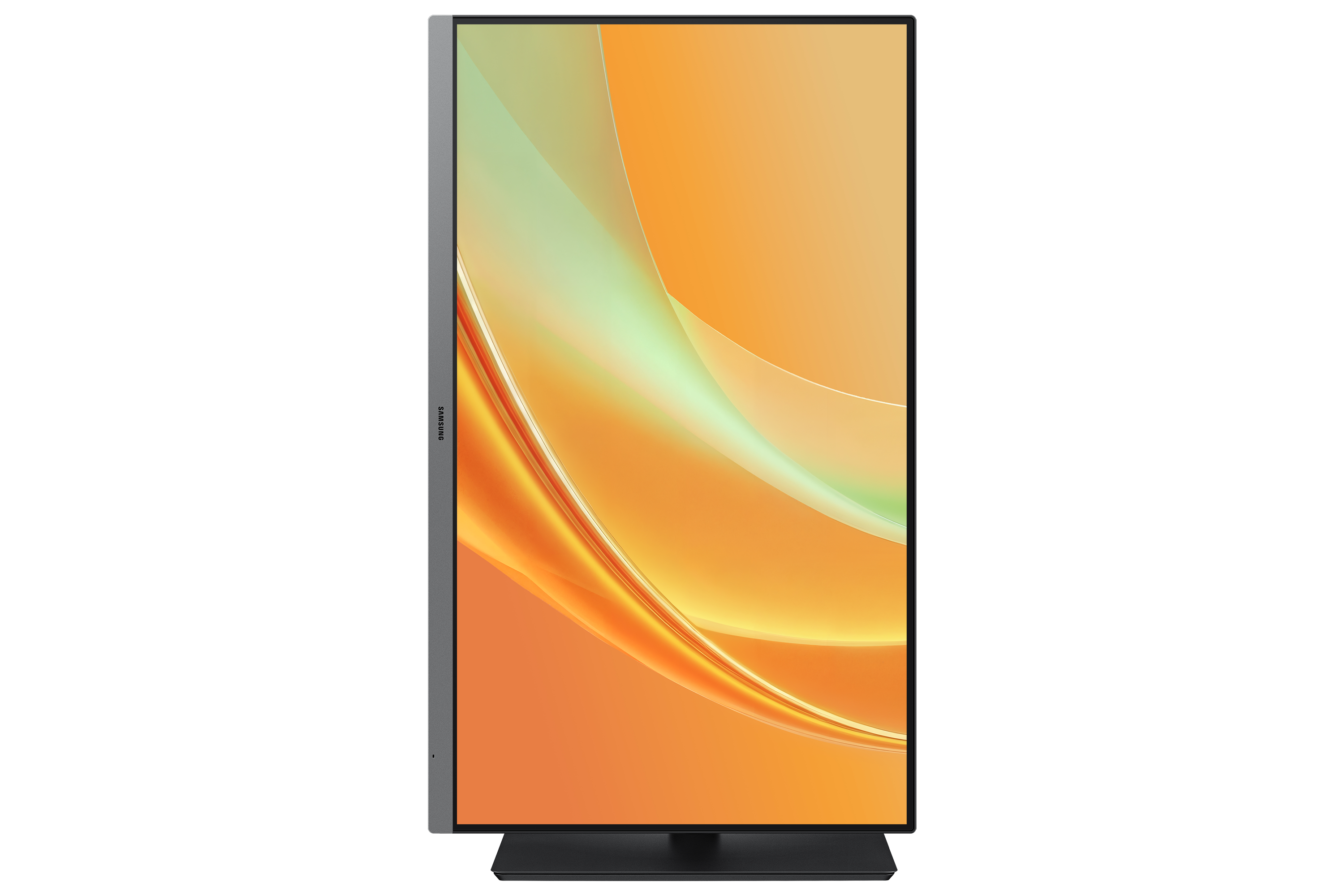 A vertical Samsung monitor displaying an abstract orange and green background on a black surface.