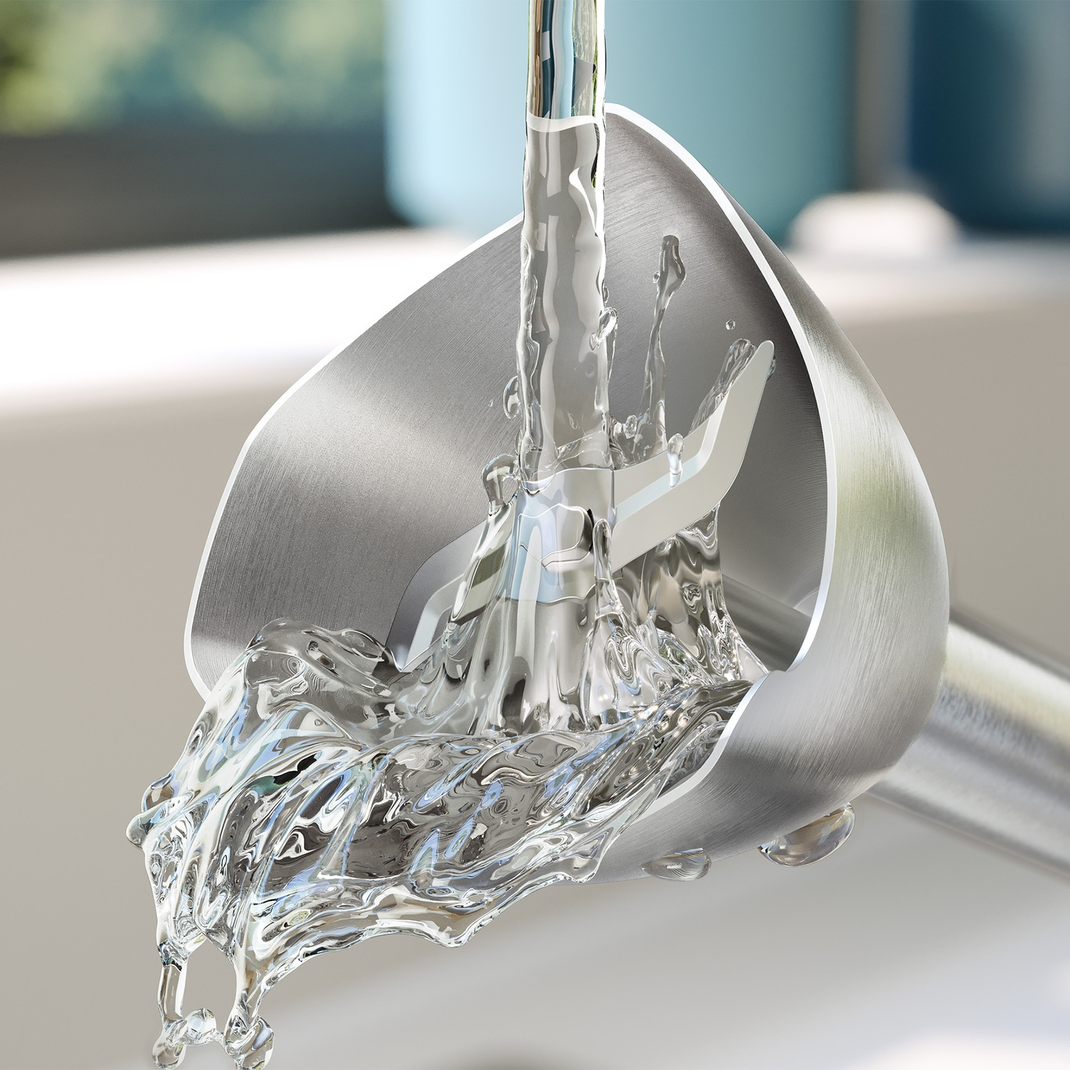 Water streams onto the metal foot of a hand blender, creating energetic splashes.