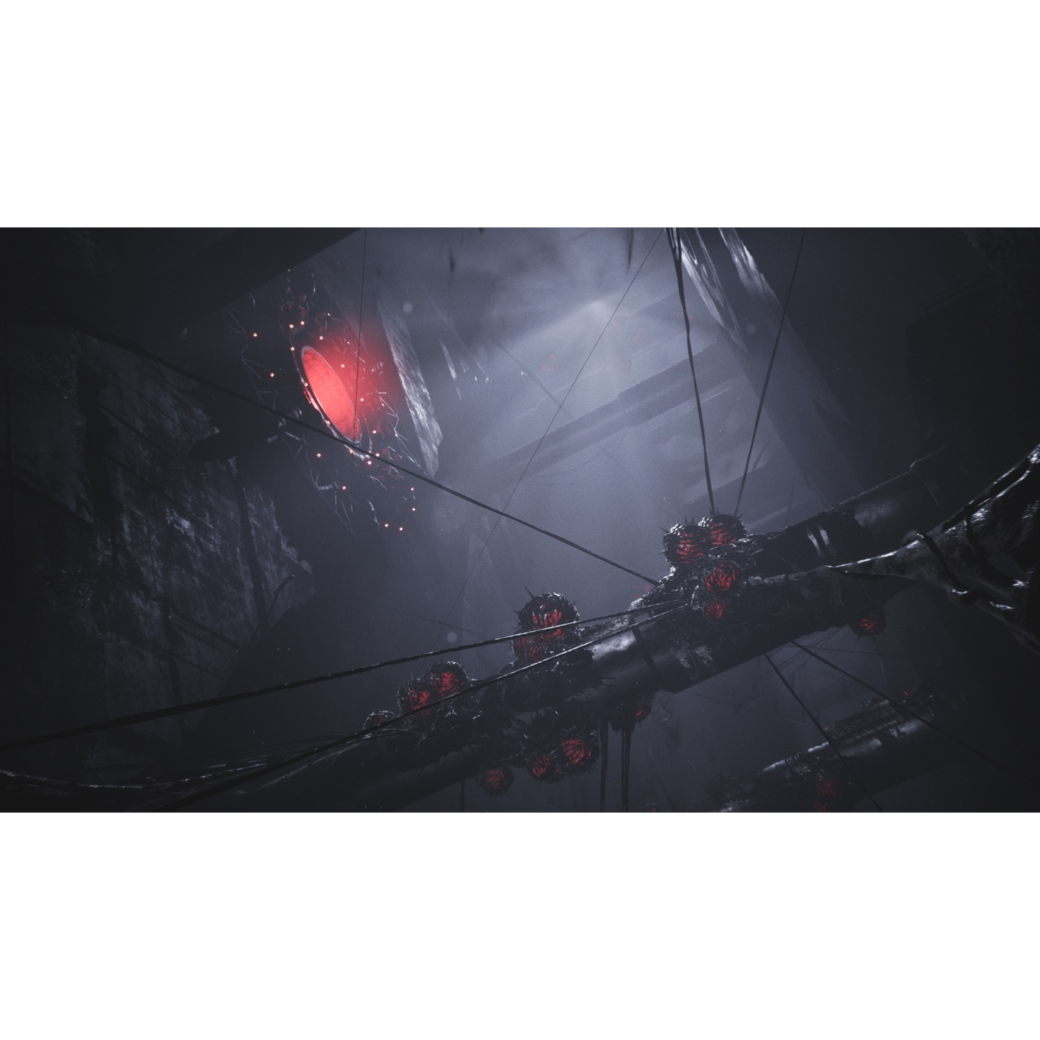 Pièce sombre avec des tuyaux et des créatures rouges lumineuses suspendues sous un rayon de lumière.