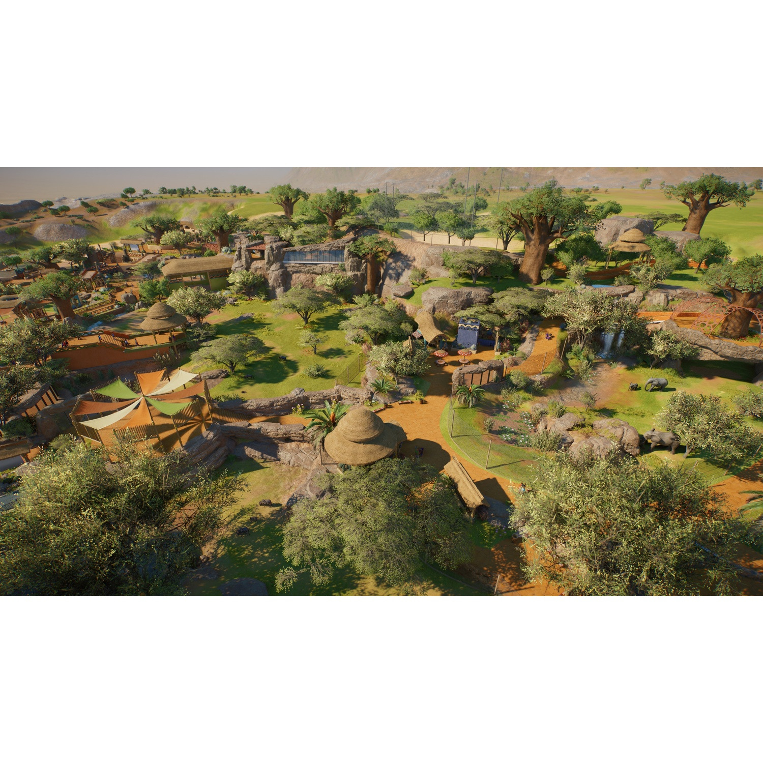 Vue aérienne d'un vaste enclos de zoo de savane africaine avec baobabs, rochers et éléphants.