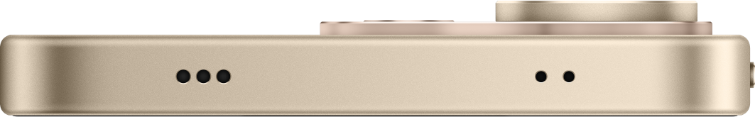 Nahaufnahme der Unterseite eines goldenen Smartphones mit Lautsprecher- und Mikrofonöffnungen gegen schwarzen Hintergrund.