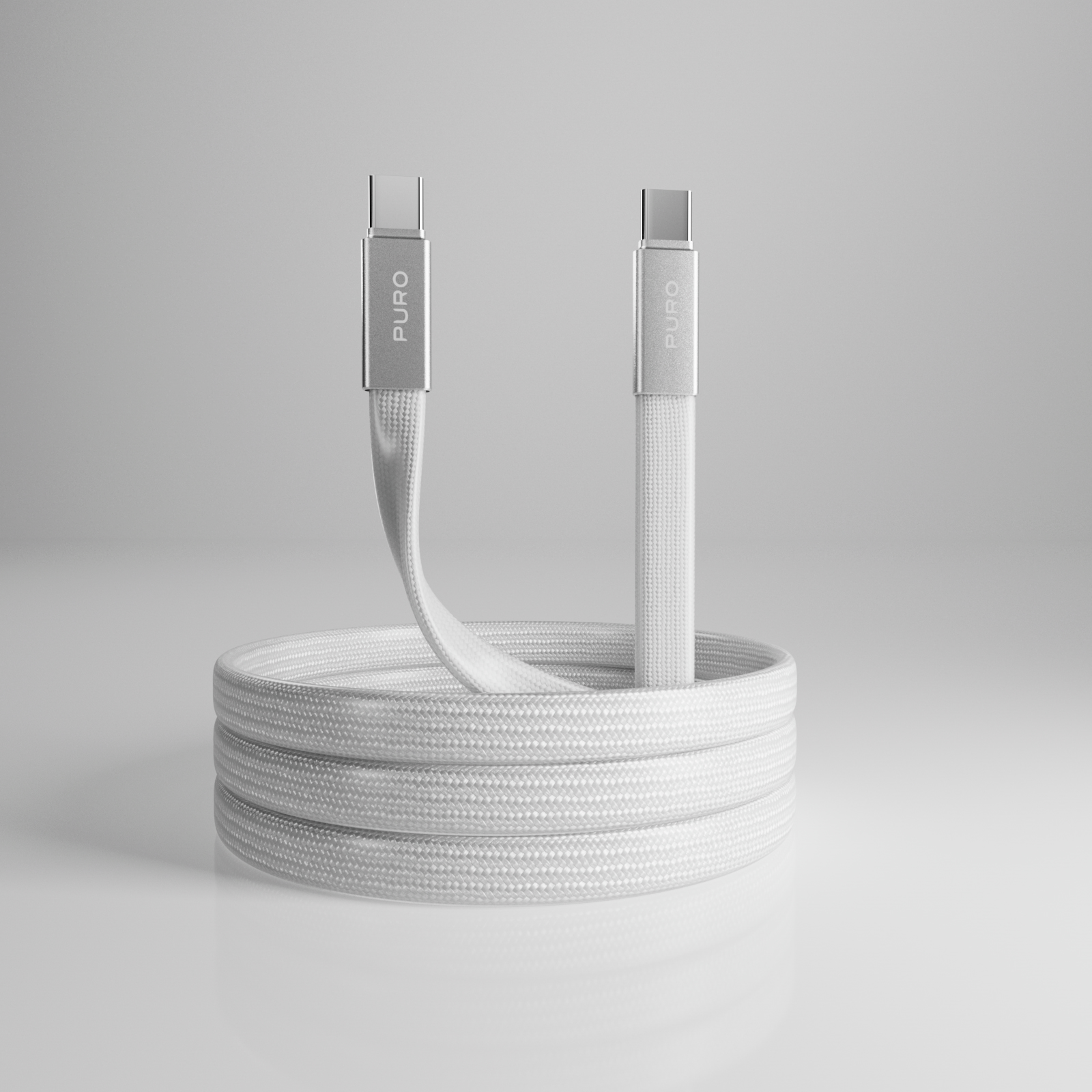 Ein weißes, geflochtenes USB-C-Kabel auf einer grauen Oberfläche, mit silbernen Steckern.