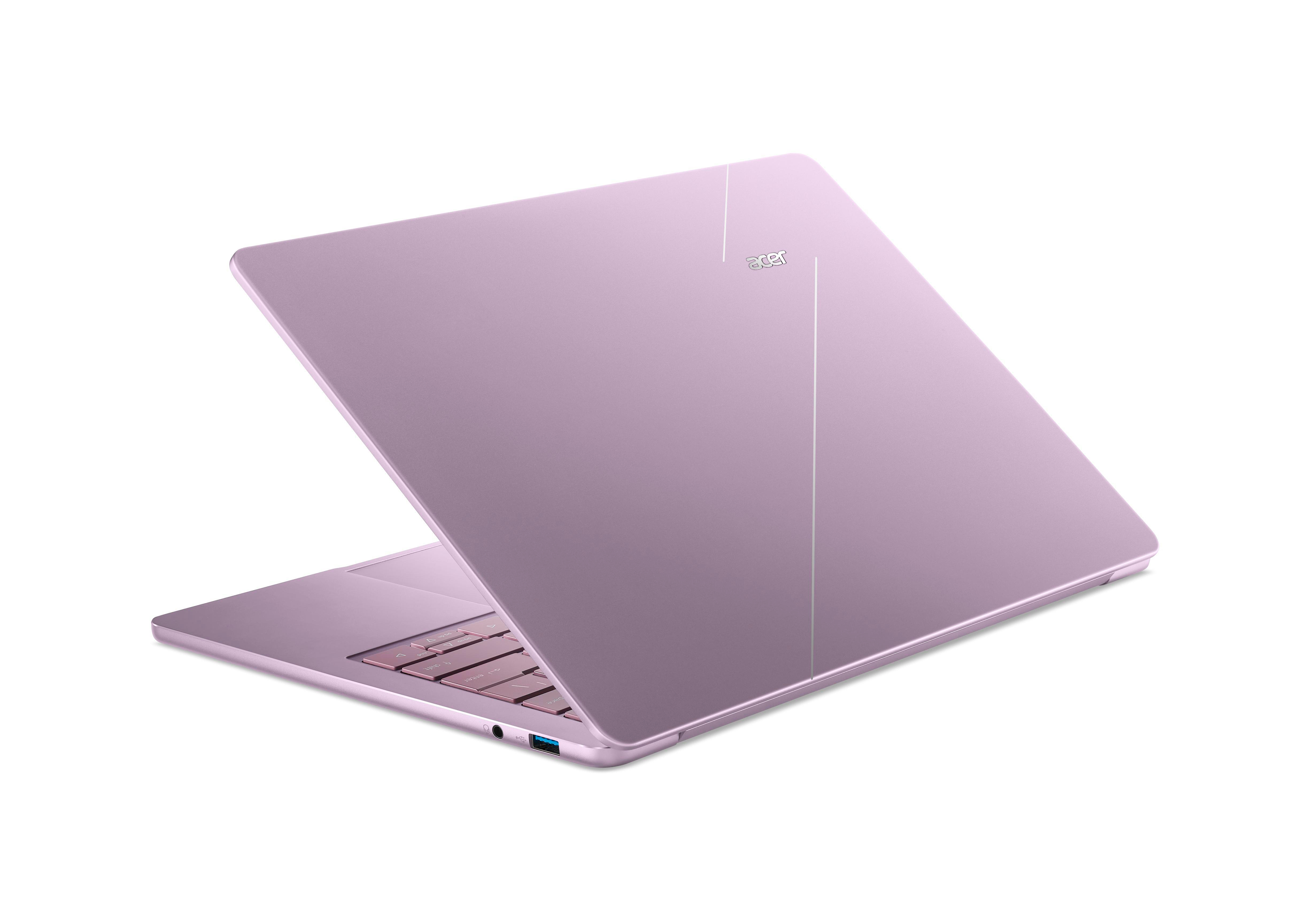 Ein rosafarbener Acer-Laptop steht halb geöffnet auf weißem Hintergrund, mit sichtbarer Tastatur und Anschlüssen.