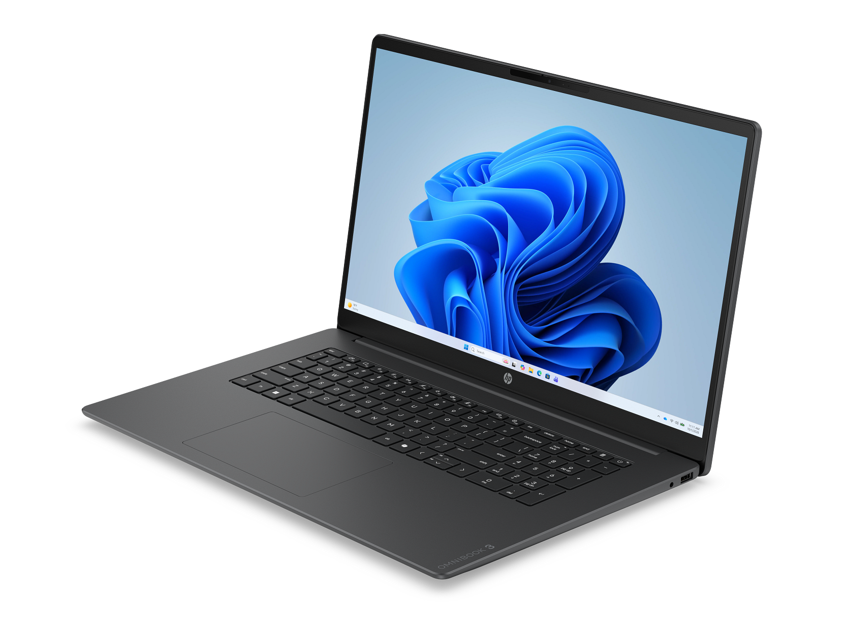 Szary laptop na czarnym tle z niebieską tapetą na ekranie.