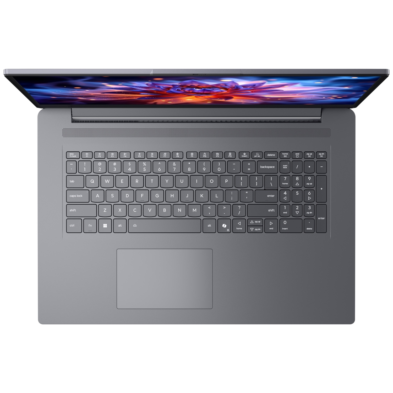 Vue de dessus d'un ordinateur portable gris avec clavier azerty, pavé numérique et écran coloré.