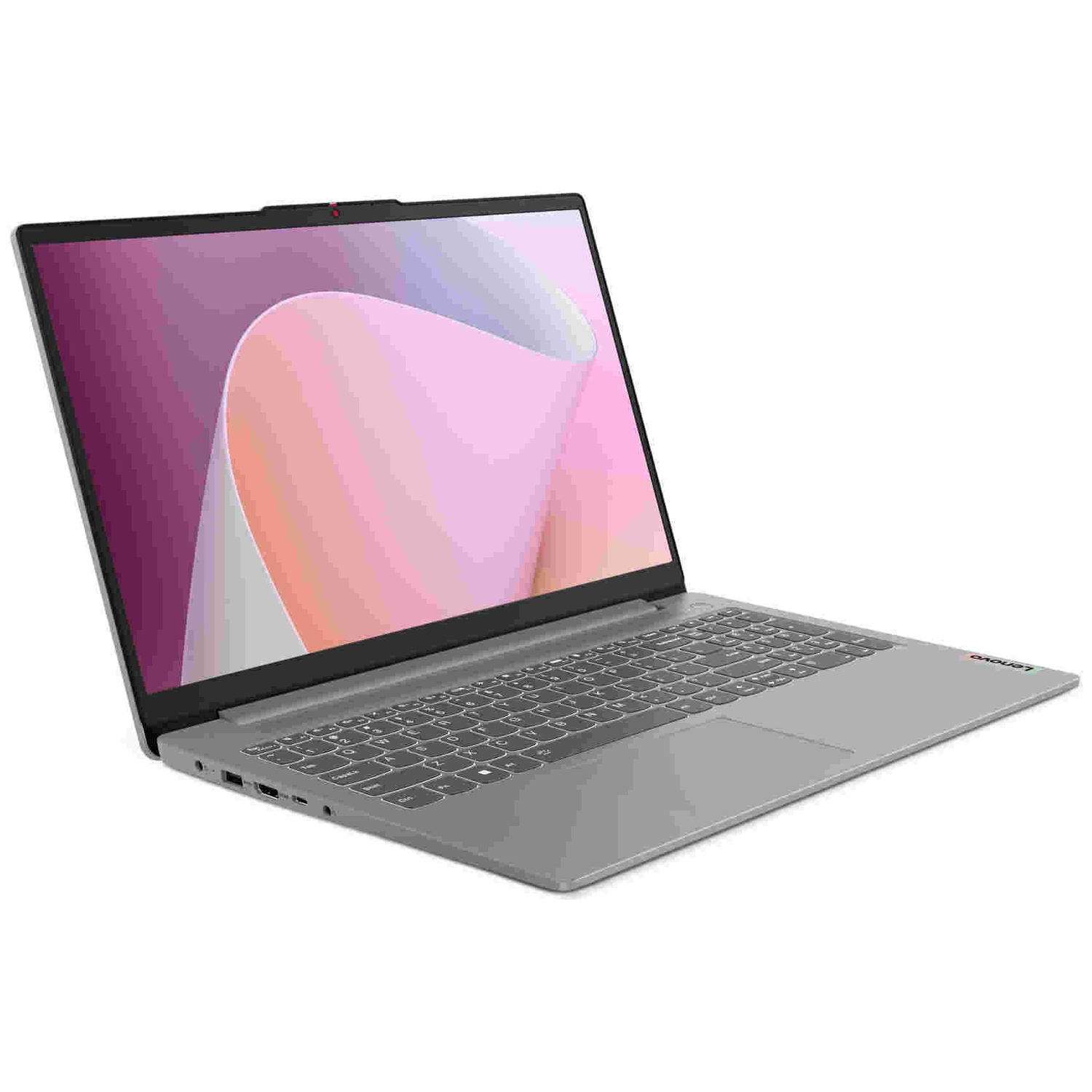 Un ordinateur portable Lenovo argenté repose sur un fond blanc avec un fond d'écran abstrait rose.