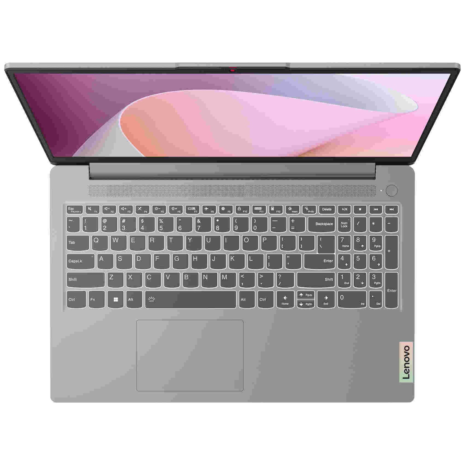 Un ordinateur portable Lenovo gris vu du dessus, avec un clavier rétroéclairé et un écran rose.