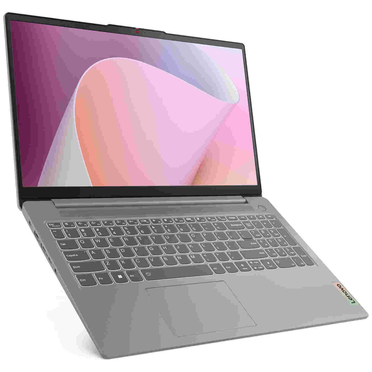 Un ordinateur portable gris avec un fond rose clair à l'écran, présenté en biais sur fond blanc.