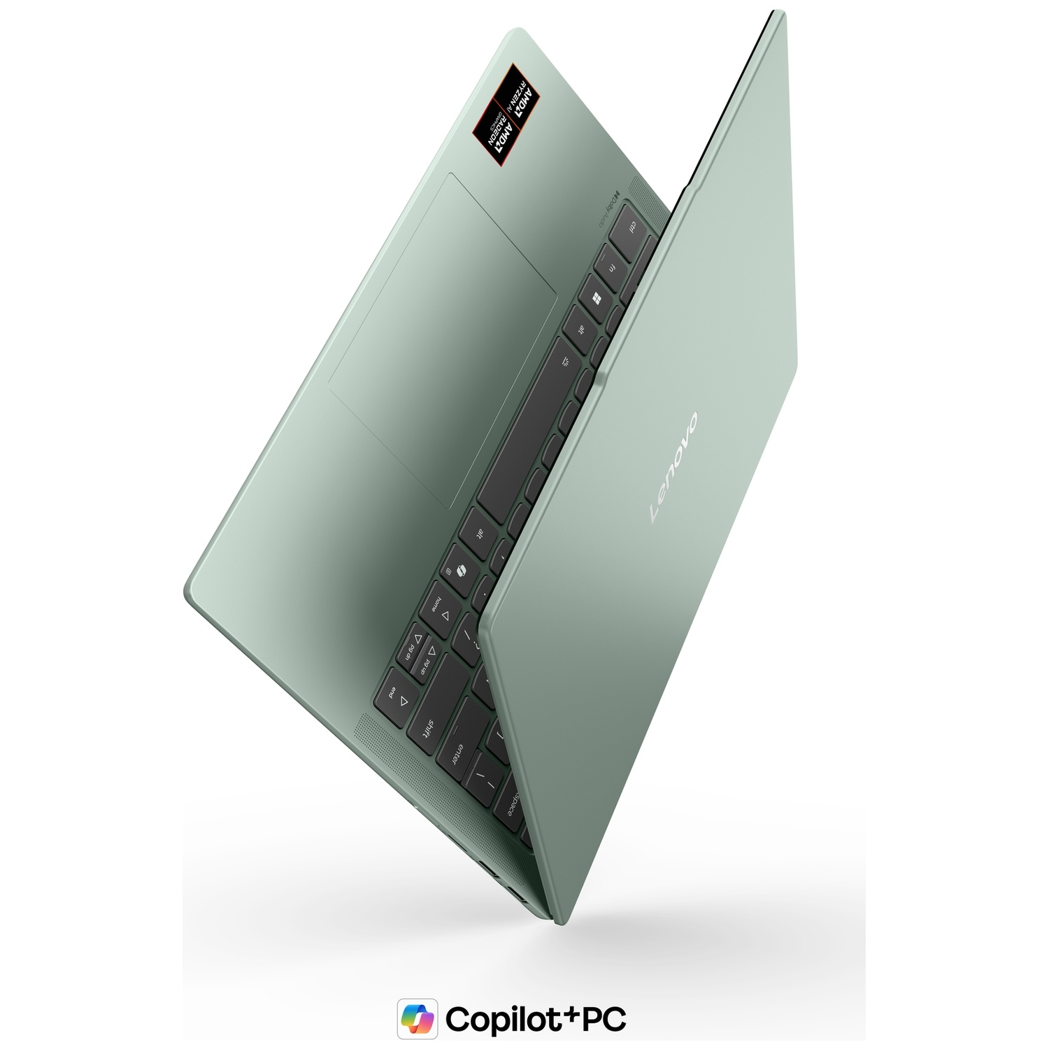 Un ordinateur portable Lenovo gris-vert flotte en angle sur un fond blanc.