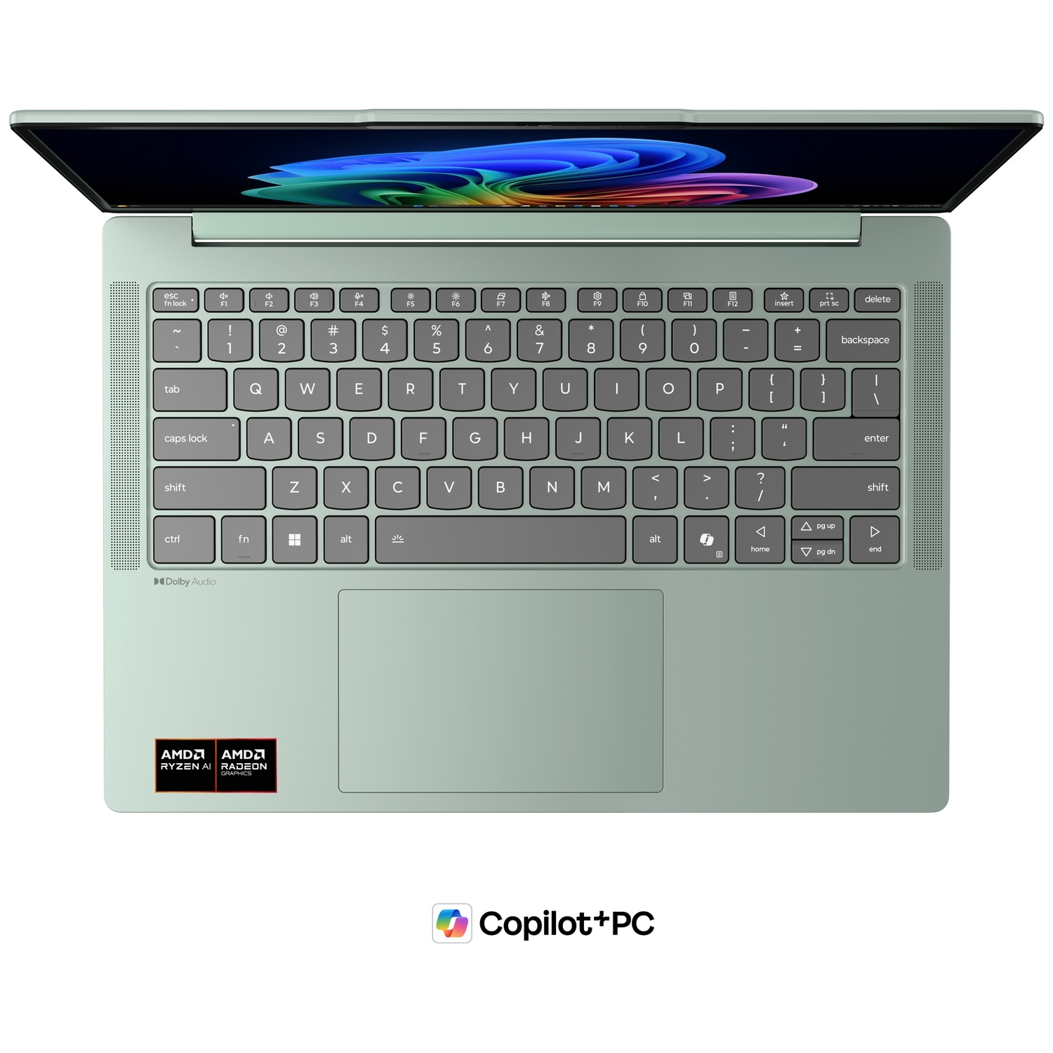 Vue de dessus d'un ordinateur portable vert clair avec clavier, pavé tactile et écran affichant un fond d'écran coloré.