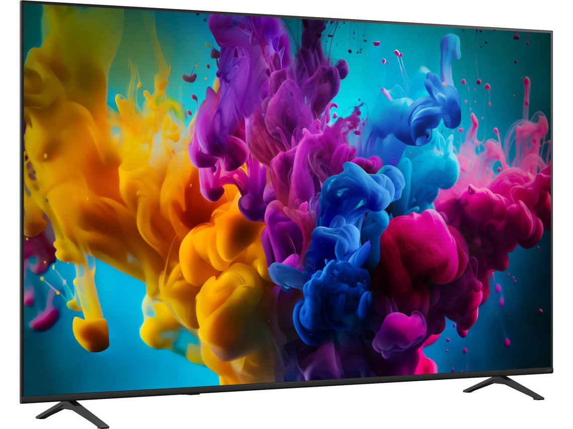 Un televisor de pantalla plana muestra una explosión vibrante de colores amarillo, morado, azul y rosa sobre fondo azul.