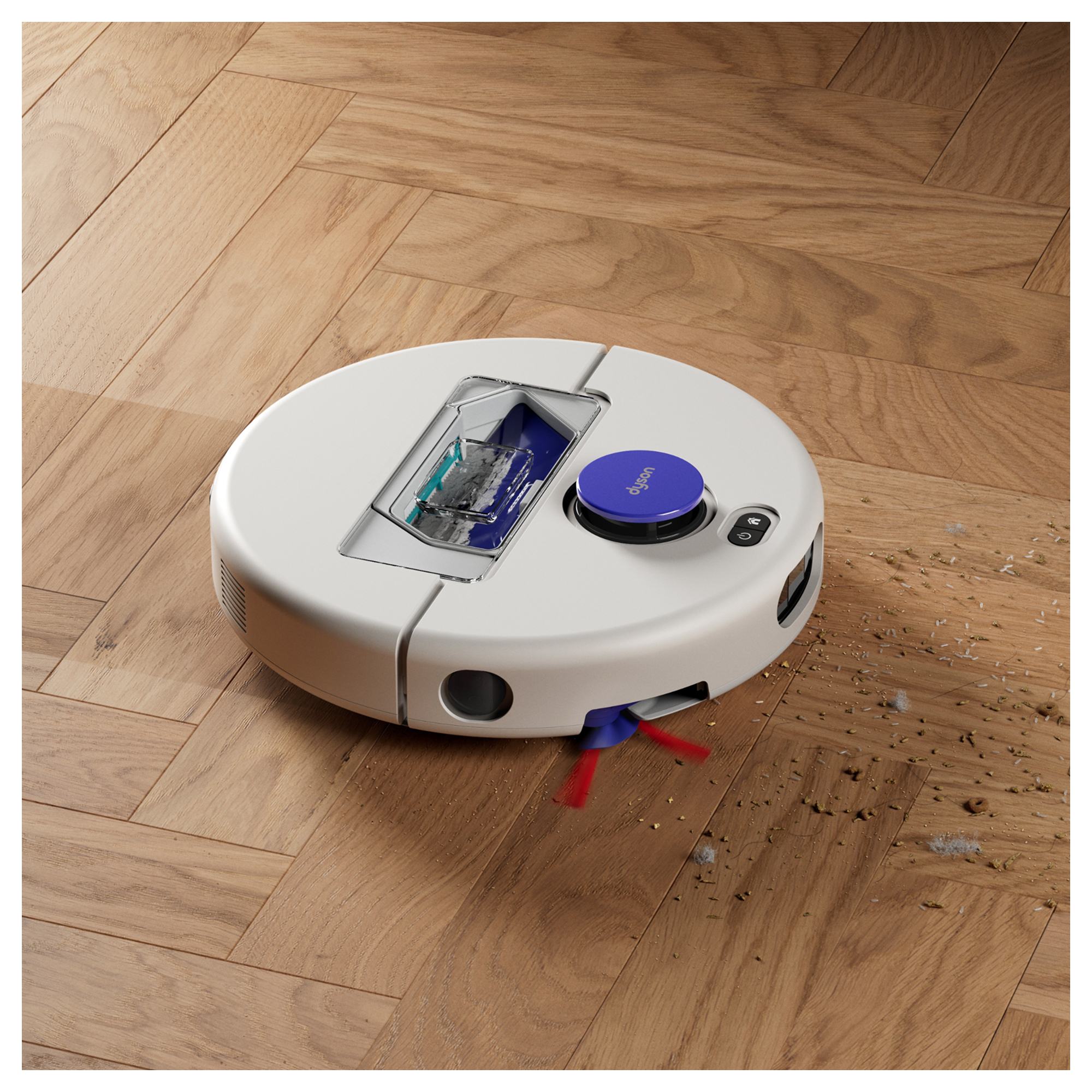 Ein weißer Dyson Saugroboter reinigt Schmutz auf einem Holzdielenboden.