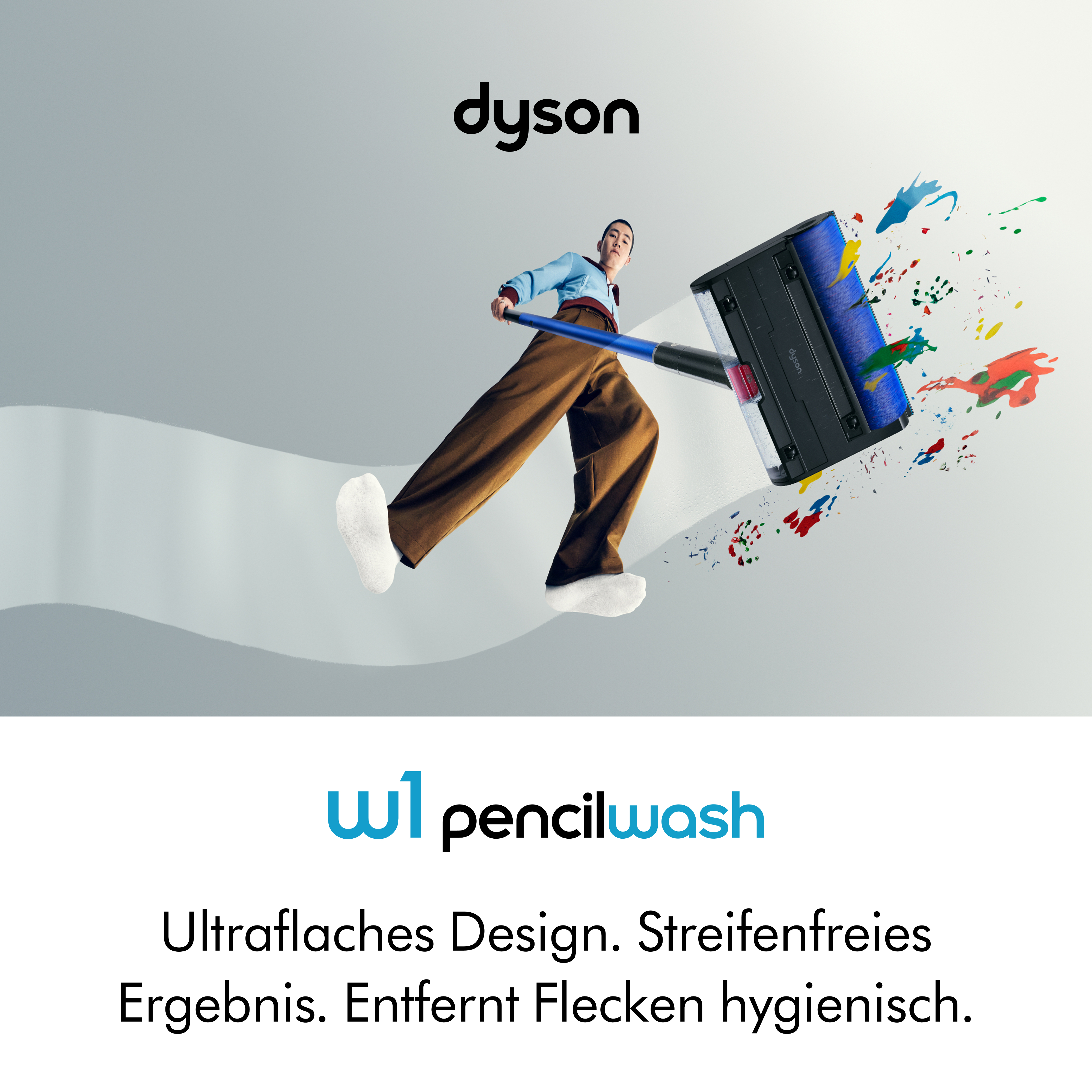 Person wischt bunten Schmutz mit einem Dyson Pencilwash weg.