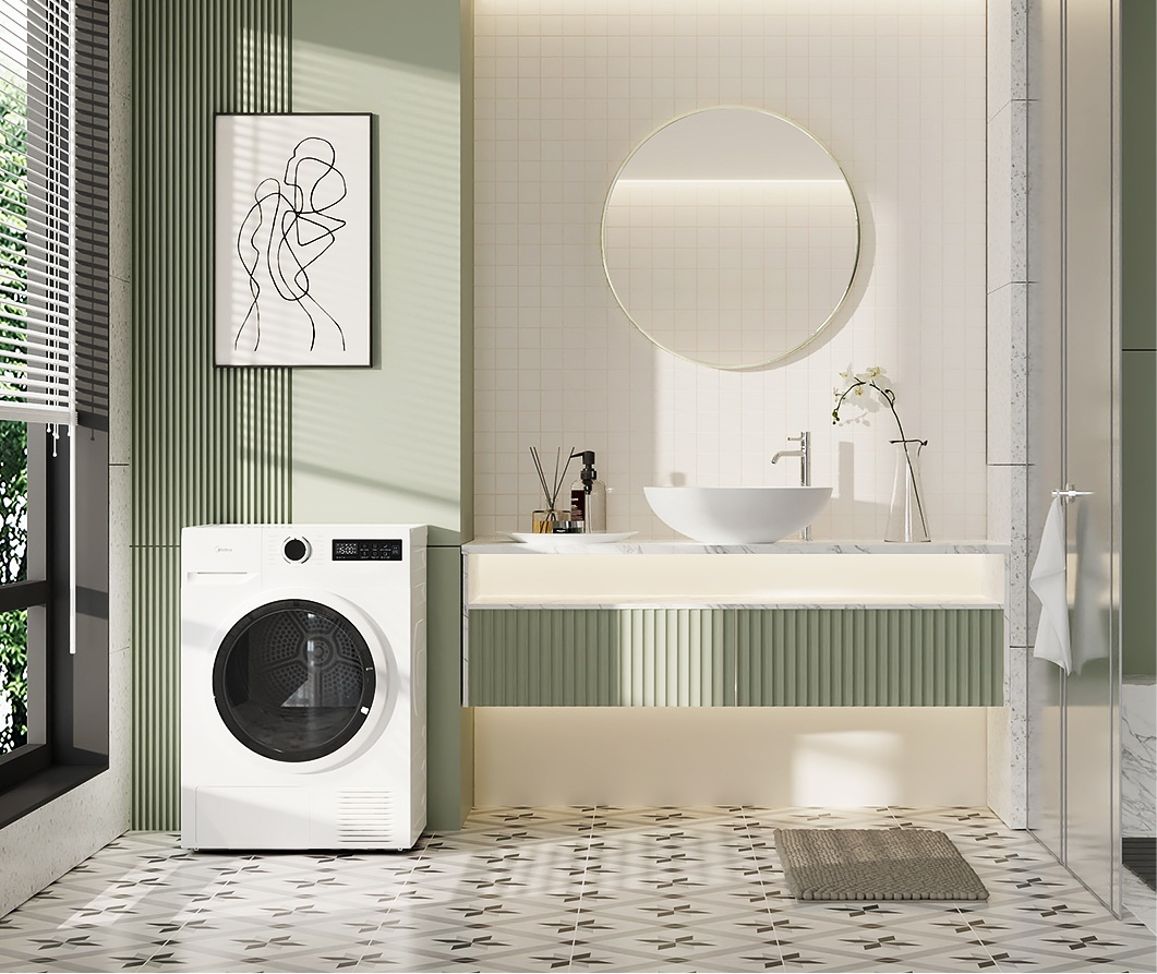 Nowoczesna łazienka z zieloną ścianą, pralką, umywalką nablatową, okrągłym lustrem i wzorzystą podłogą.
