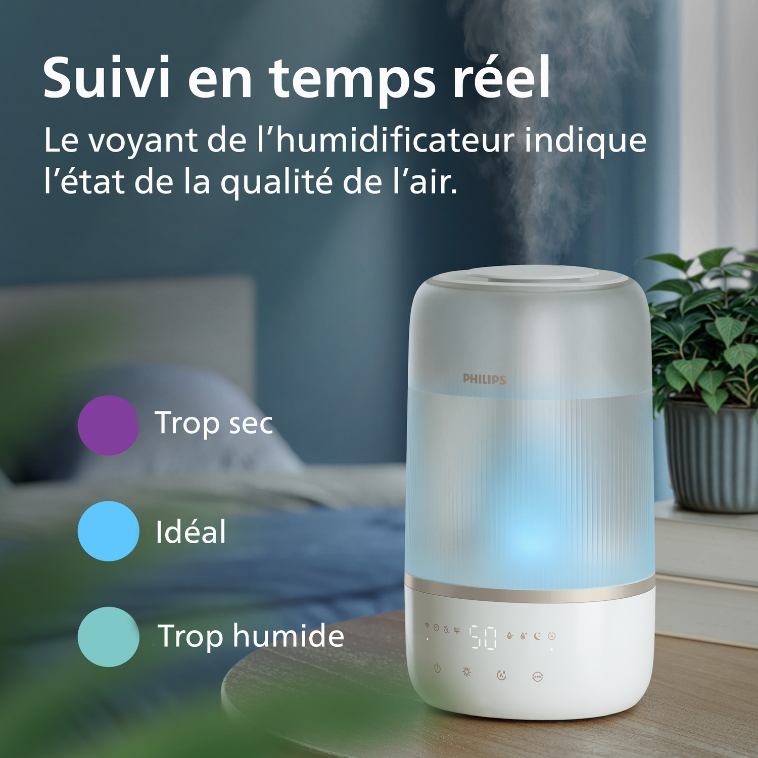 Un humidificateur Philips sur une table en bois avec des indicateurs de qualité de l'air.