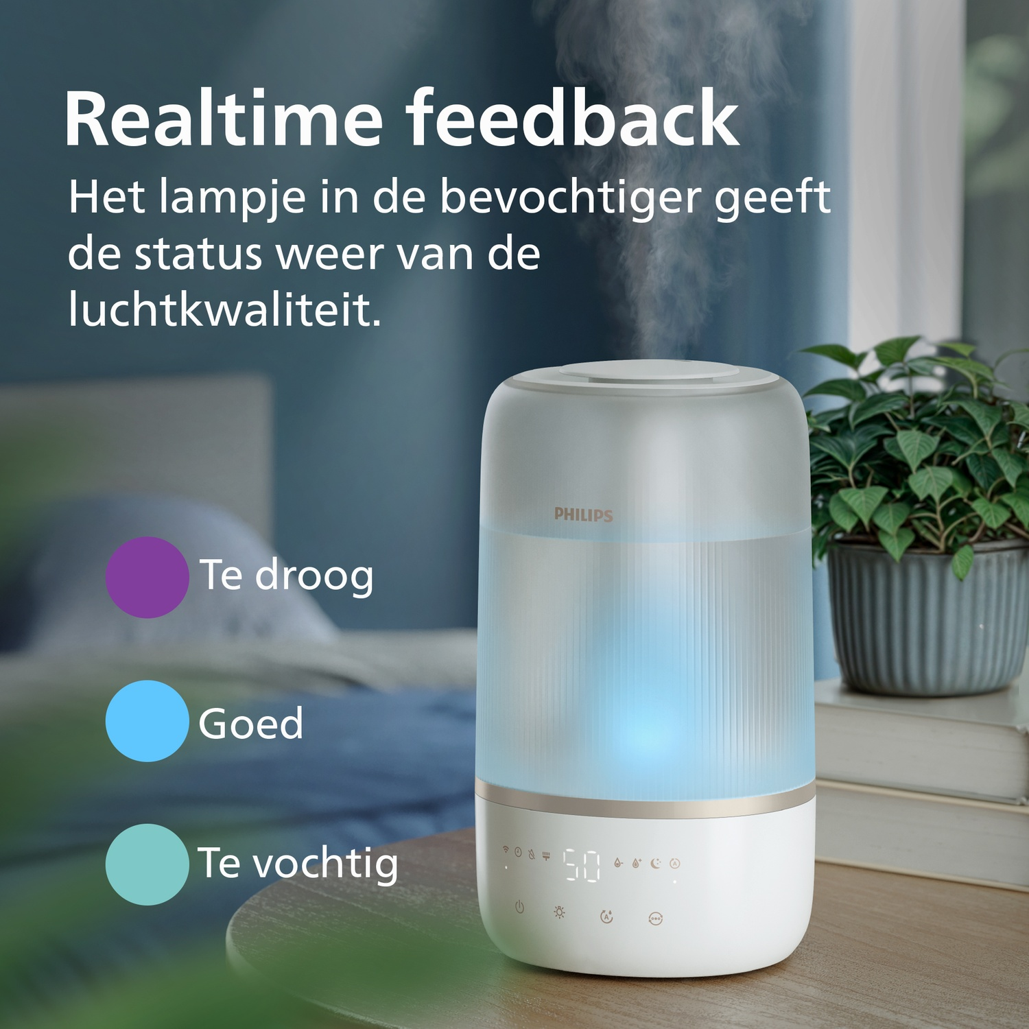 A Philips humidifier on a table with text and color indicators for air quality.