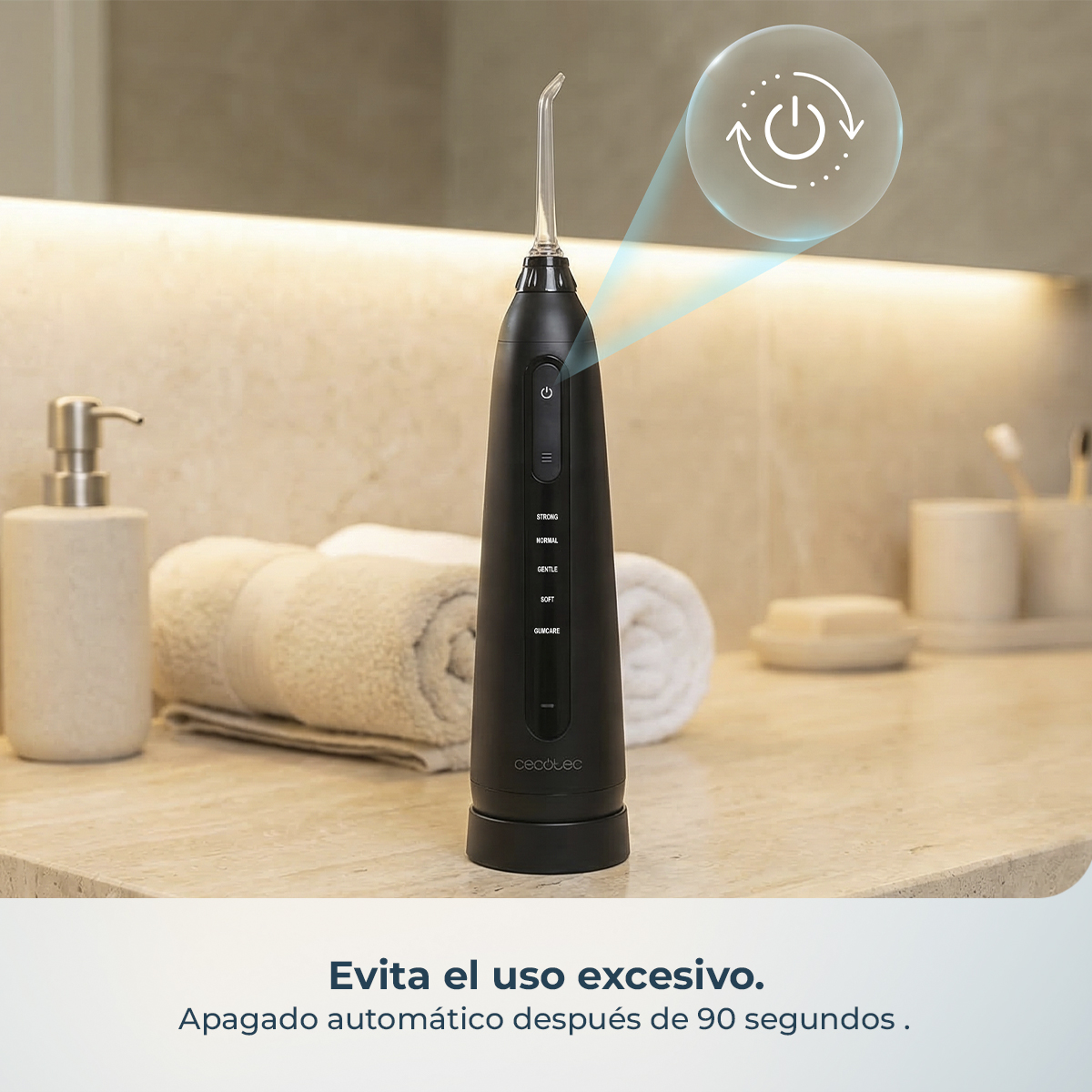 Irrigador bucal negro en encimera de baño con texto e icono de encendido.