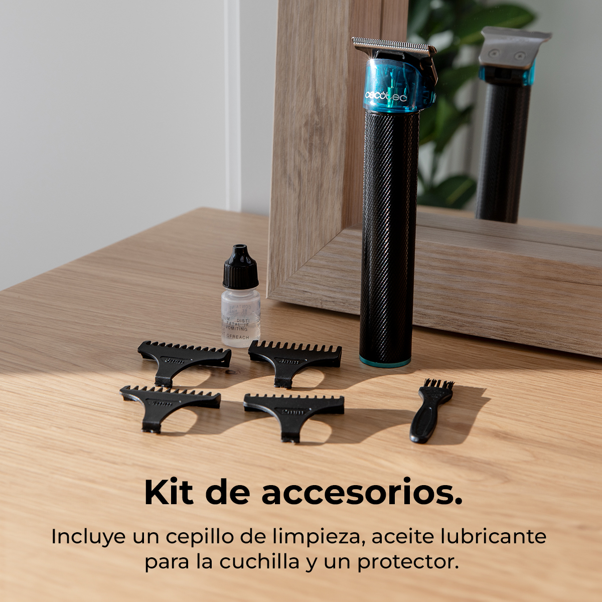 Cortapelos con cuatro accesorios, botella de aceite y cepillo de limpieza en una mesa de madera.