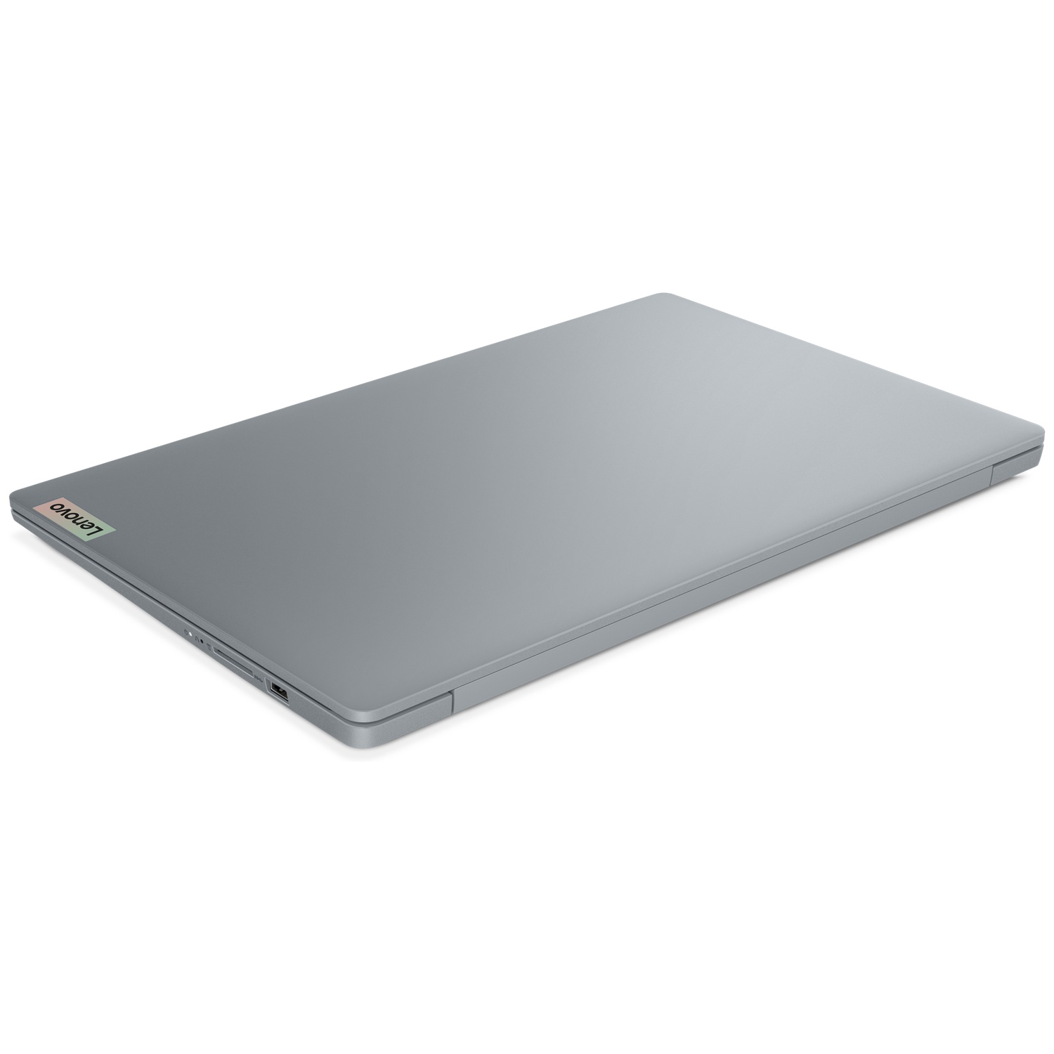 Un ordinateur portable Lenovo gris et fermé sur fond blanc.