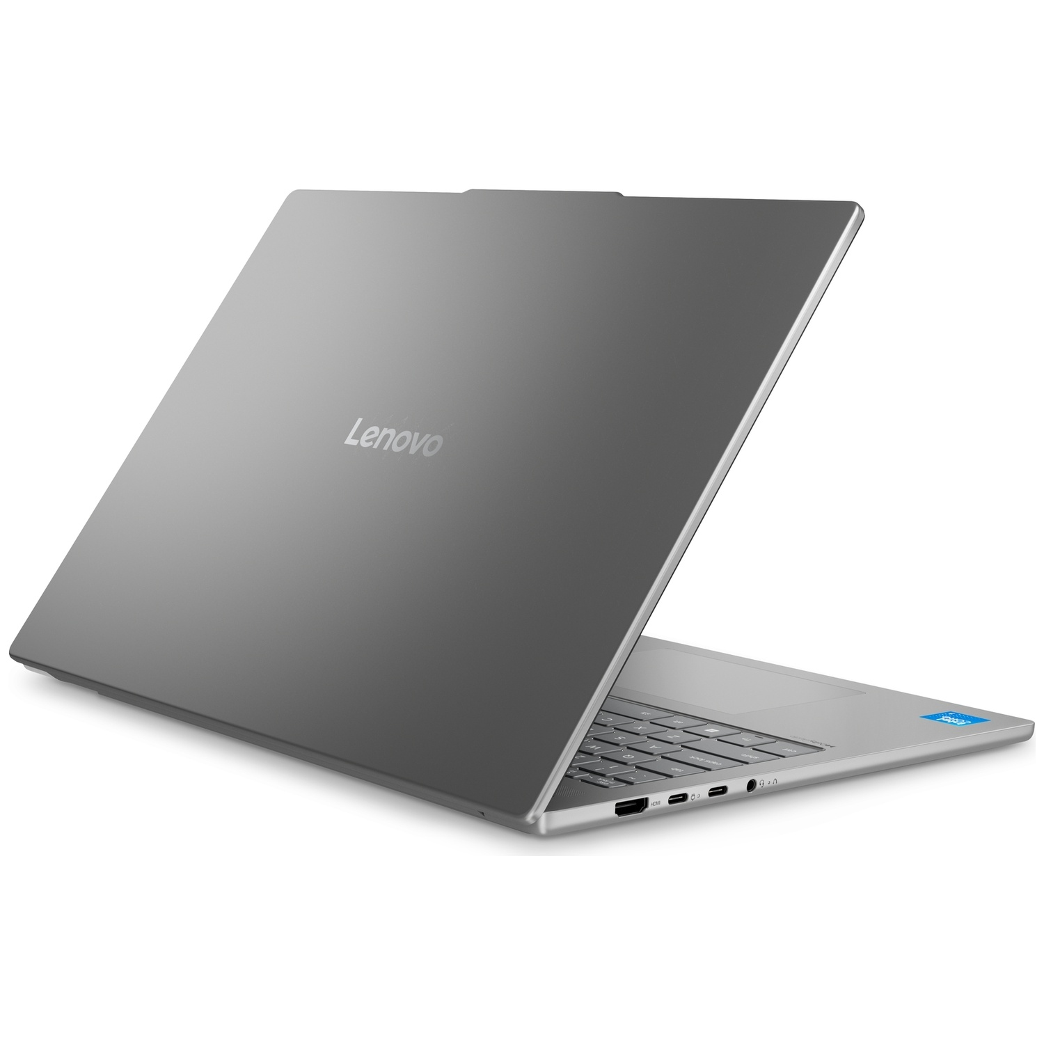 Un ordinateur portable Lenovo argenté sur une surface blanche, montrant le couvercle fermé avec le logo.