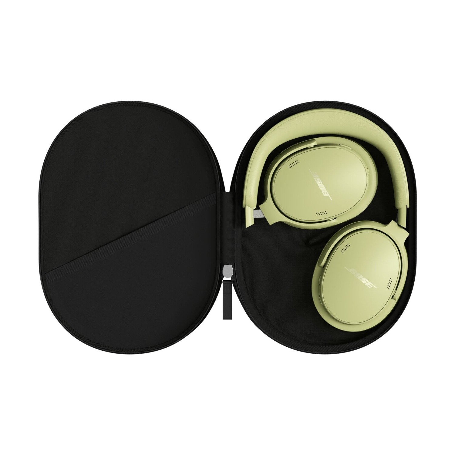 Cuffie Bose verde chiaro ripiegate ordinatamente in una custodia rigida nera, rotonda e aperta.