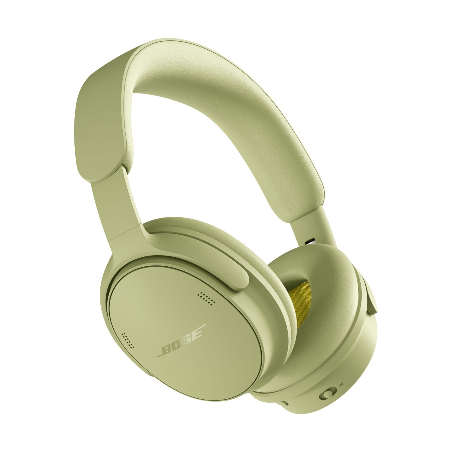 Cuffie over-ear Bose verde chiaro con cuscinetti morbidi su sfondo bianco.