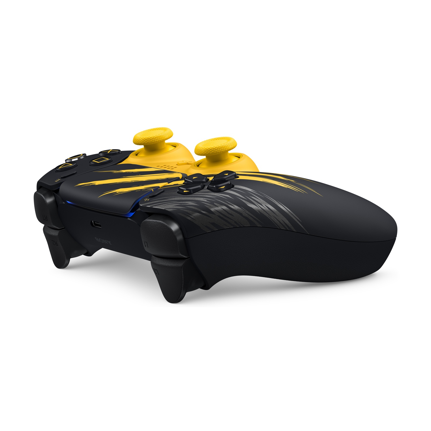 Un controller per videogiochi nero e giallo con motivi graffiati e levette gialle.
