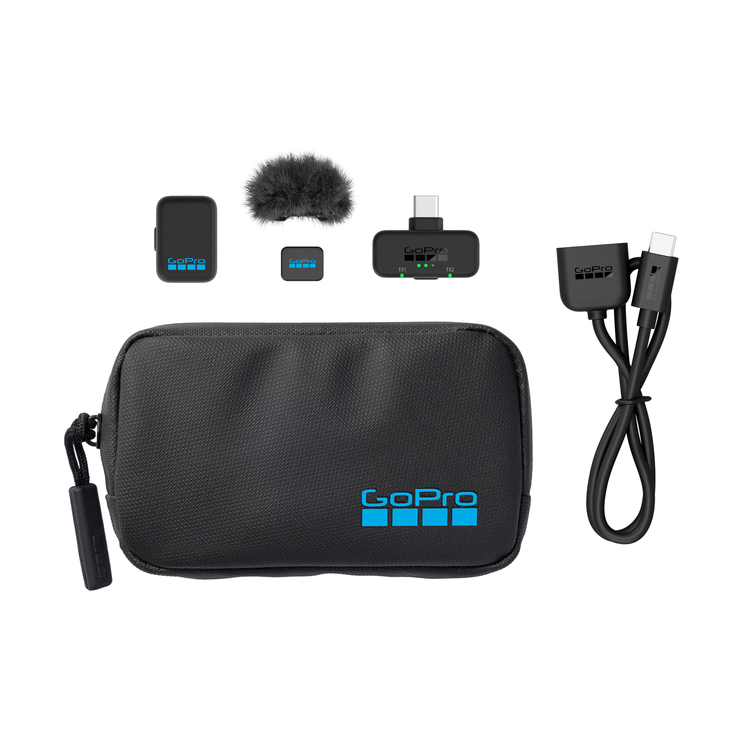 Kit microfono GoPro con custodia, trasmettitori, ricevitore, antivento e cavo USB-C su sfondo bianco.