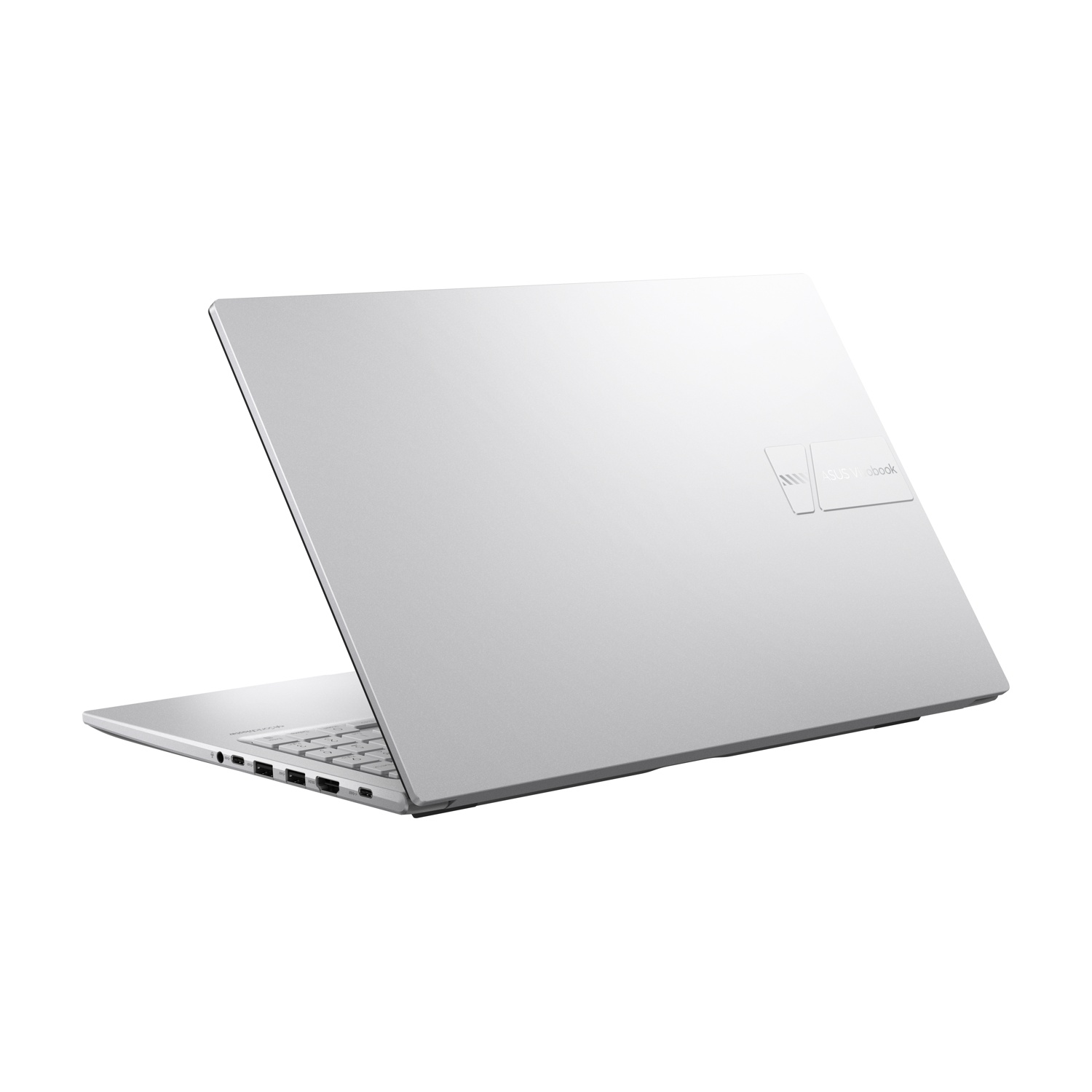 Un computer portatile Asus Vivobook argentato è mostrato a metà aperto su una superficie bianca.