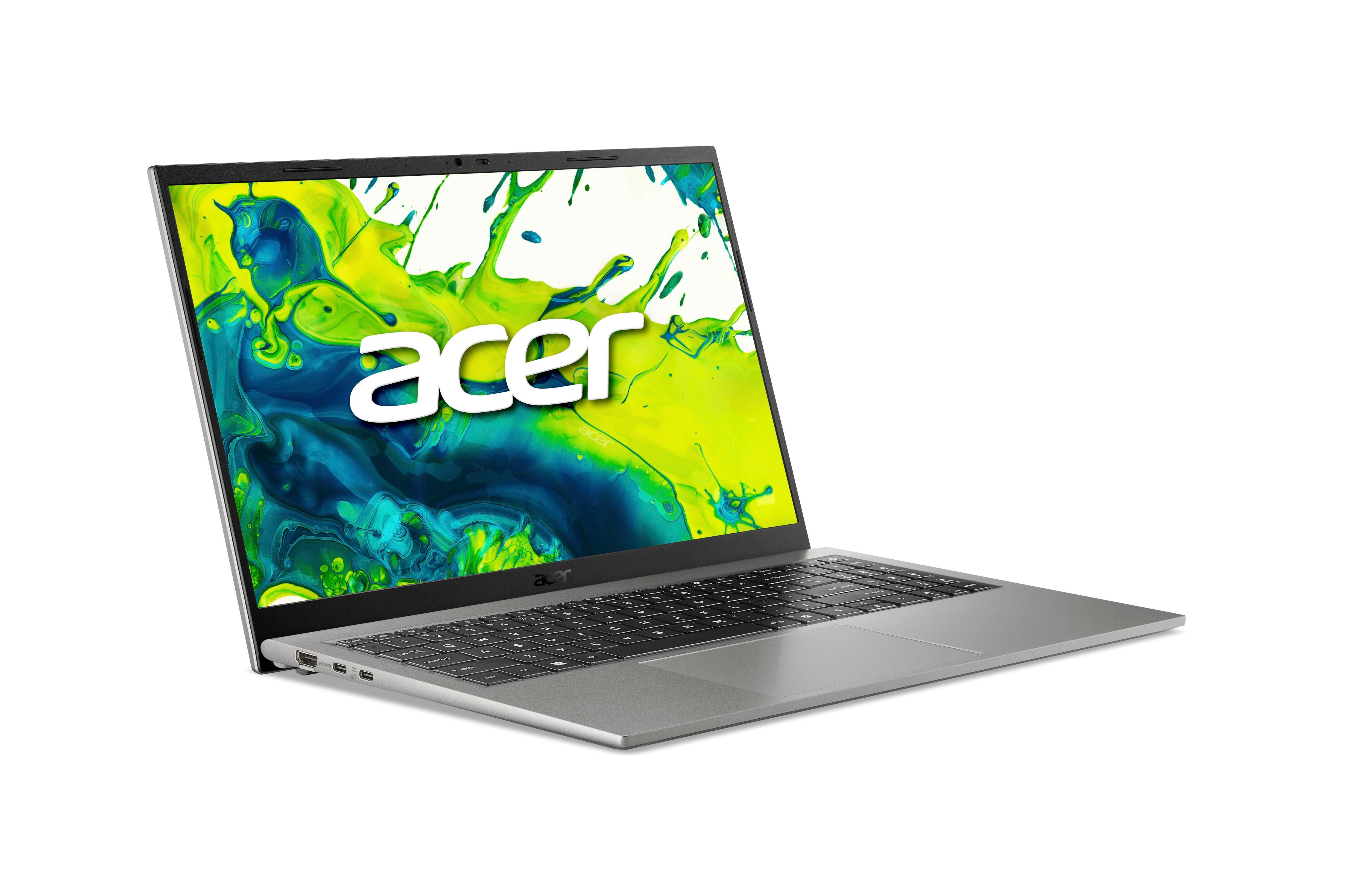 Ein silberner Acer-Laptop mit grün-blauem Farbspitzer auf dem Bildschirm, fotografiert auf weißem Hintergrund.