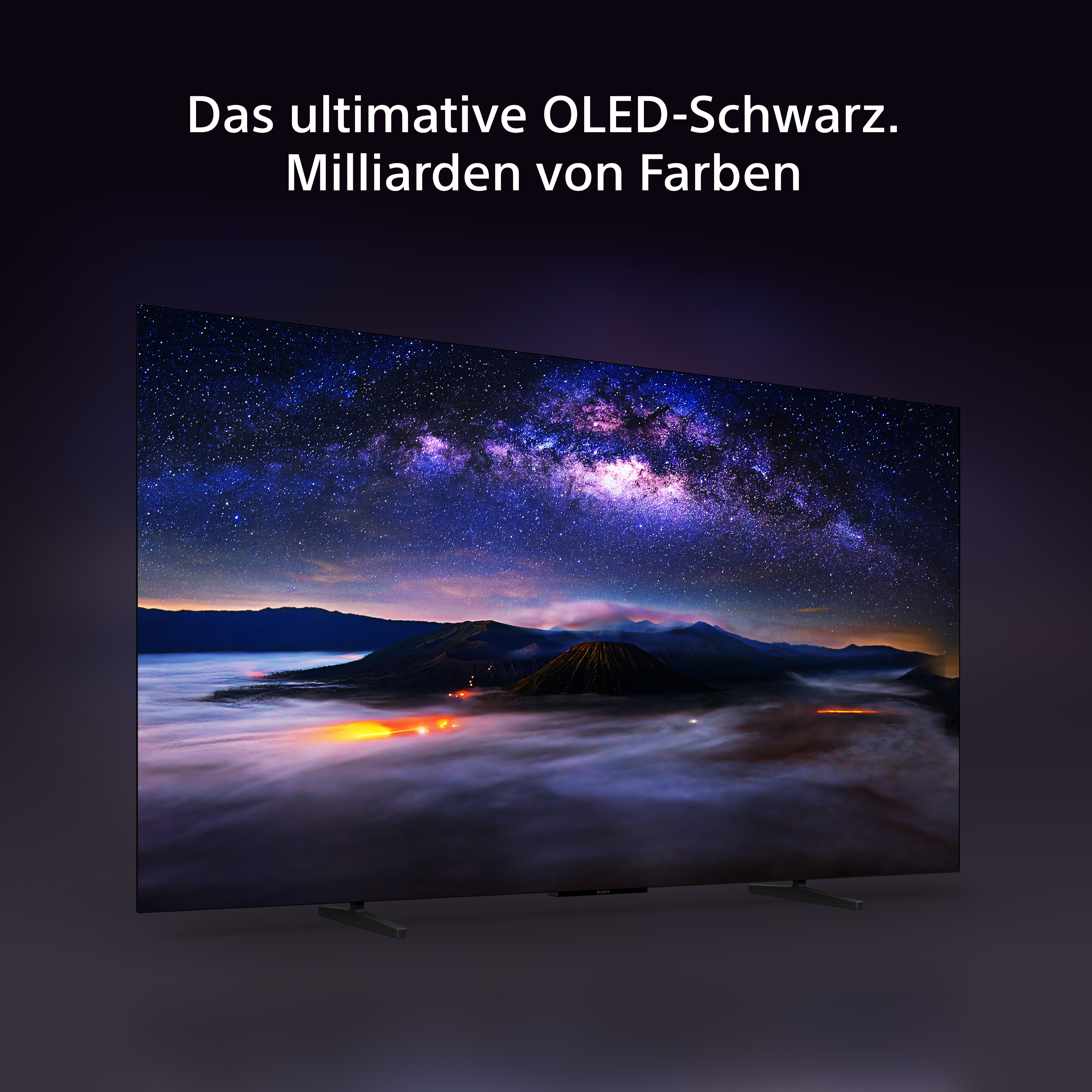 Ein OLED-Fernseher zeigt einen lebendigen Nachthimmel und eine Landschaft, mit deutschem Text oben.