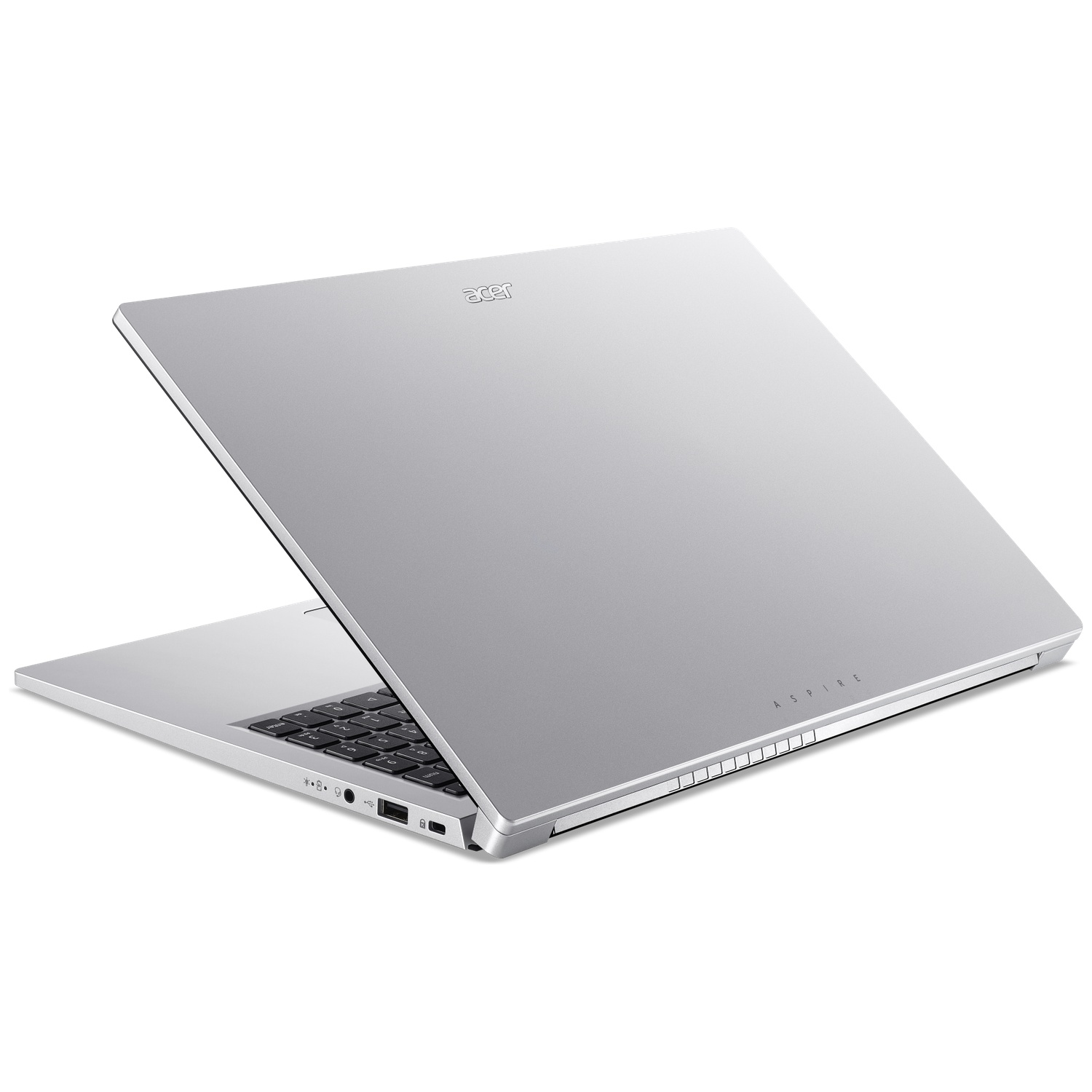 Un ordinateur portable Acer Aspire argenté est partiellement fermé, montrant son couvercle métallique et son clavier.