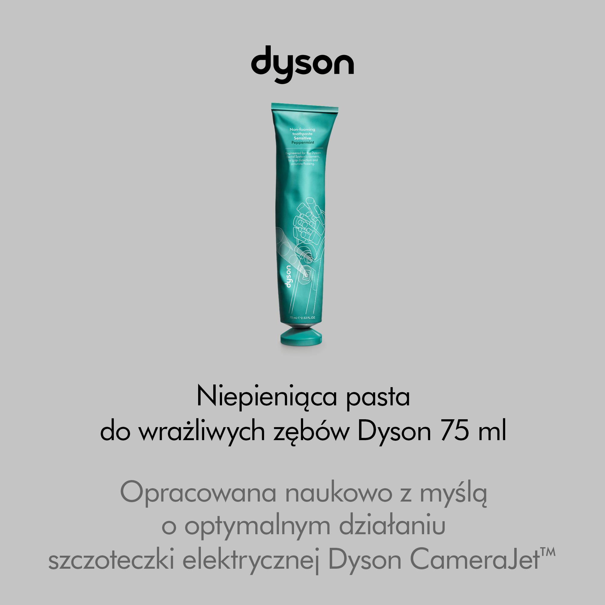 Zielona tuba pasty do zębów Dyson na szarym tle z polskim tekstem.