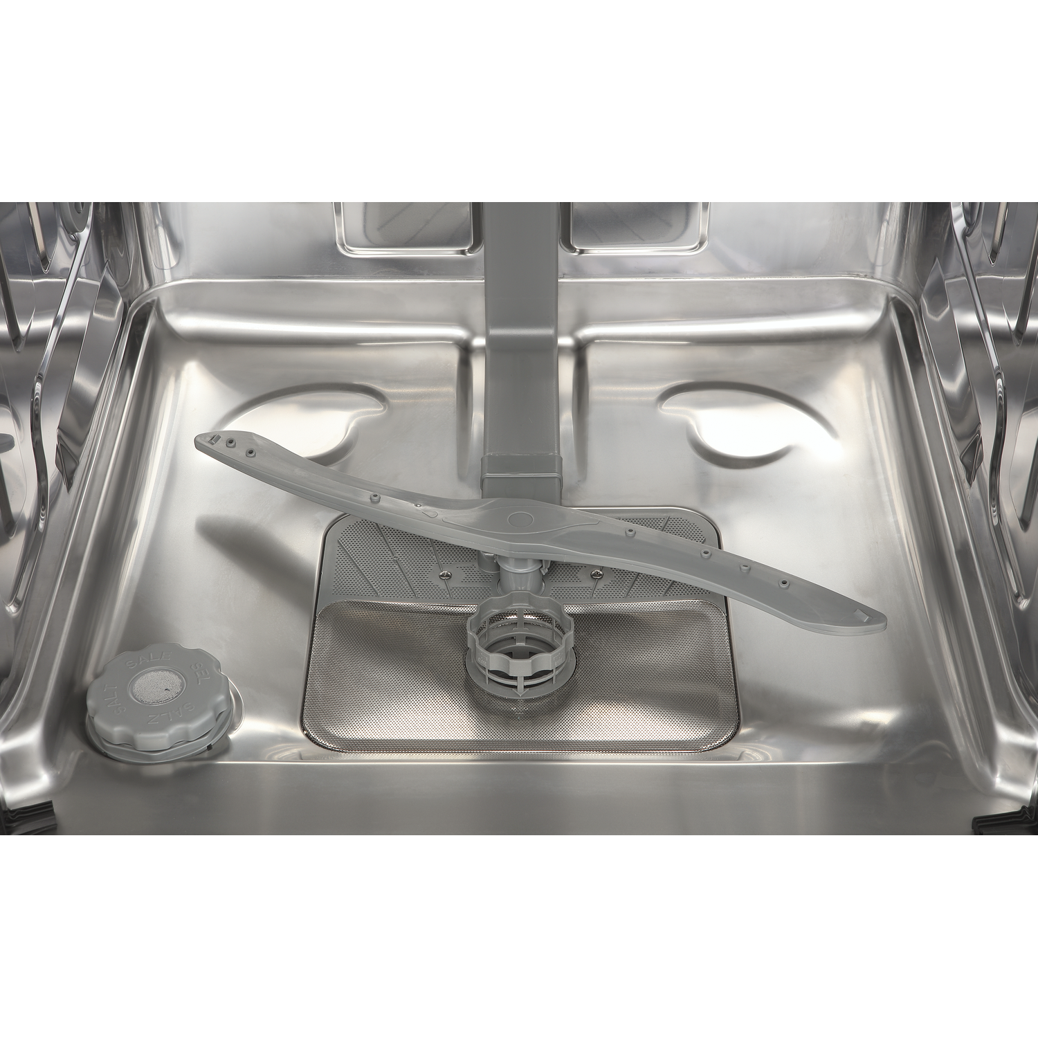 Interior of an empty stainless steel dishwasher showing the spray arm, filter, and salt cap.