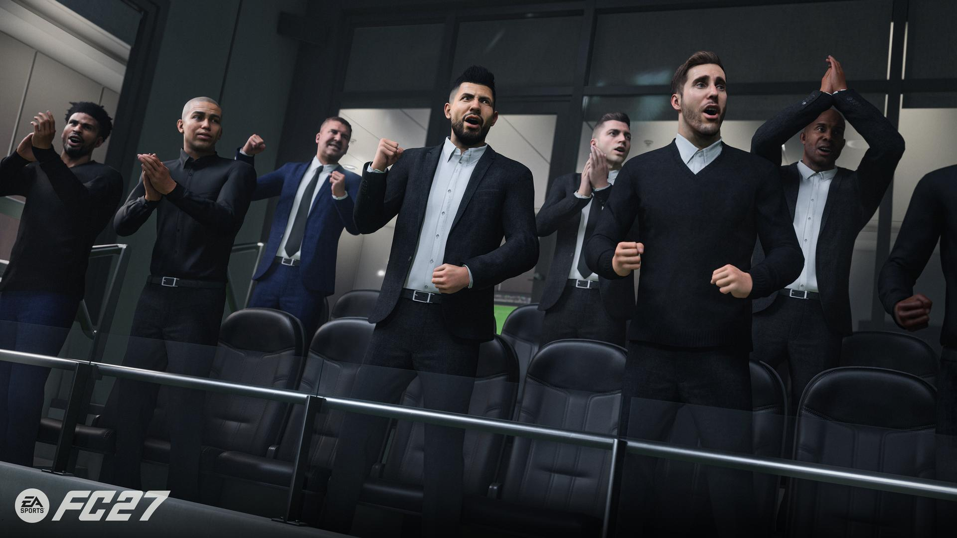 Sechs Männer im Anzug jubeln in einem Stadion auf Tribünensitzen.