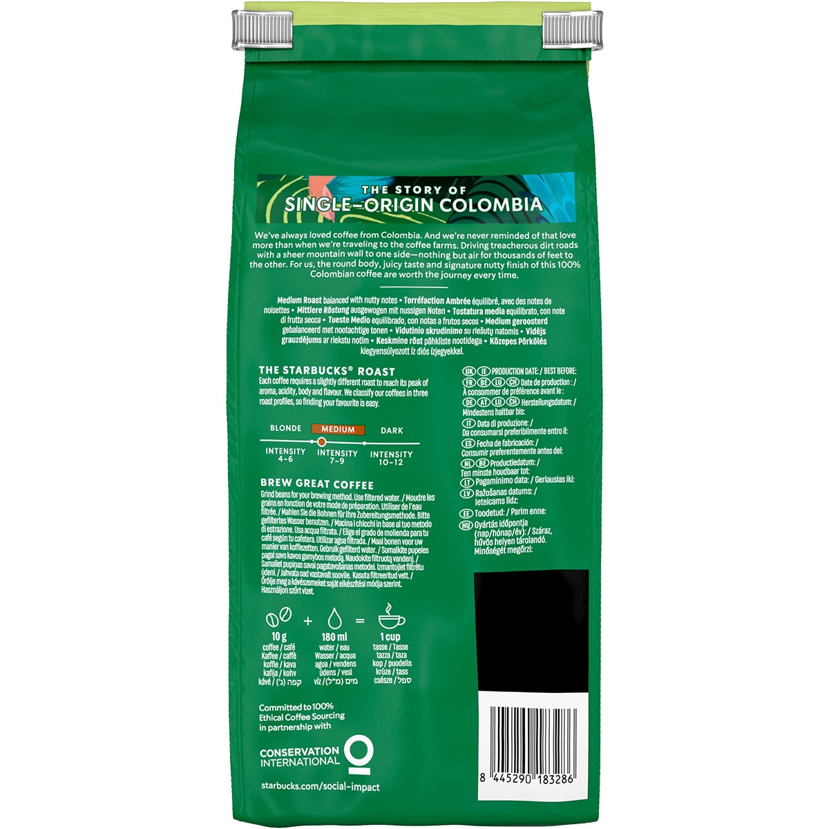 Parte trasera de una bolsa de café Starbucks Colombia verde con texto, tostado medio y código de barras.