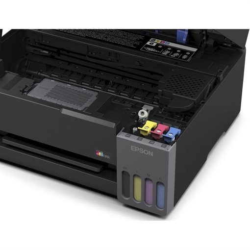 Una impresora Epson negra abierta muestra mecanismos internos y tanques de tinta visibles en negro, amarillo, magenta y cian.