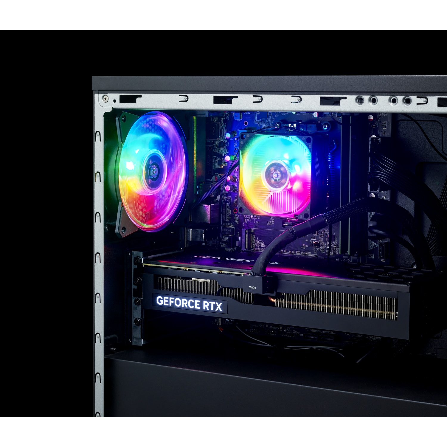Inside view of a PC tower showing colorful RGB fans, a motherboard, and a glowing GeForce RTX graphics card.