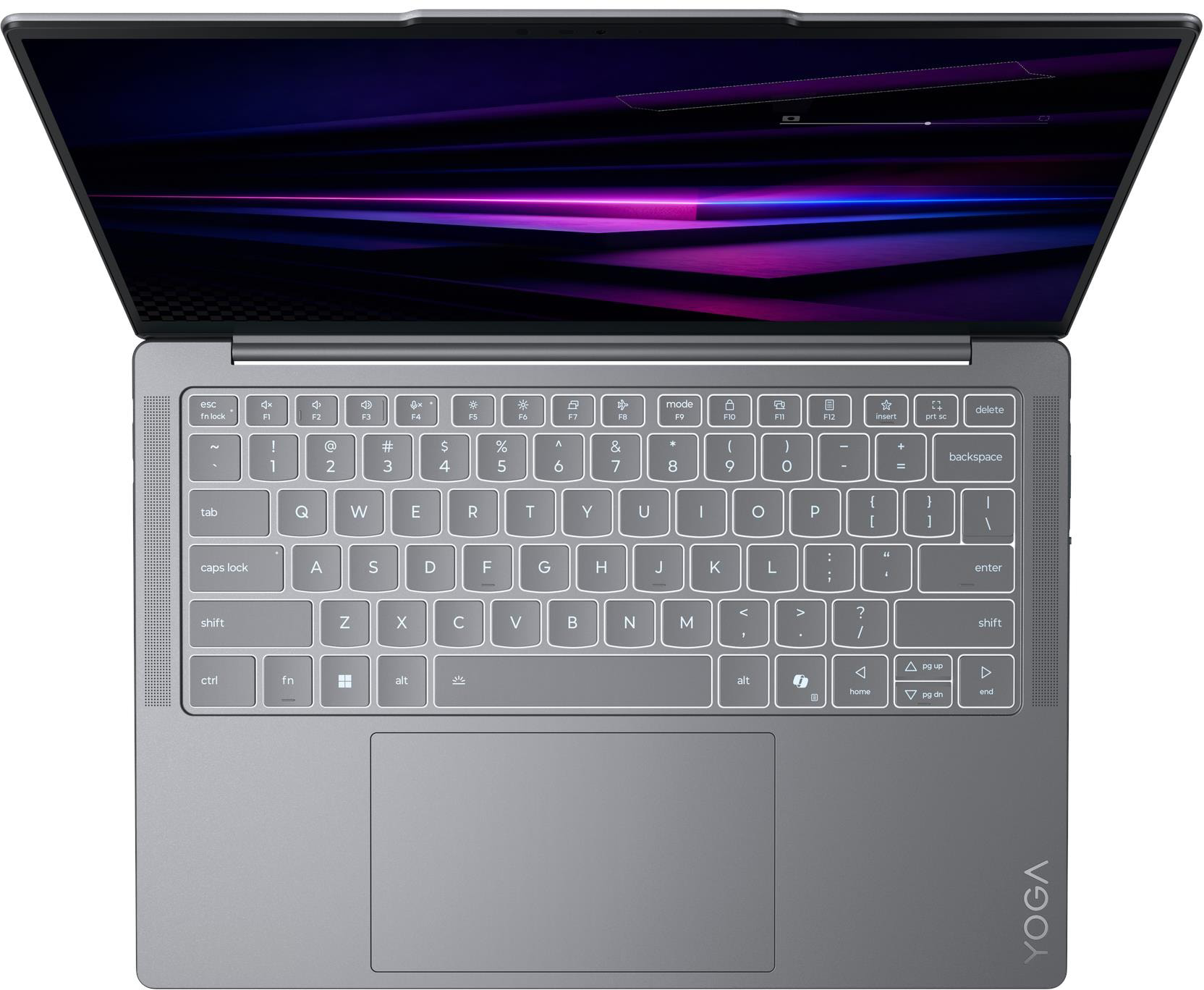 Felülnézet egy szürke laptopról nyitott képernyővel, megvilágított billentyűzettel és nagy érintőpaddal.