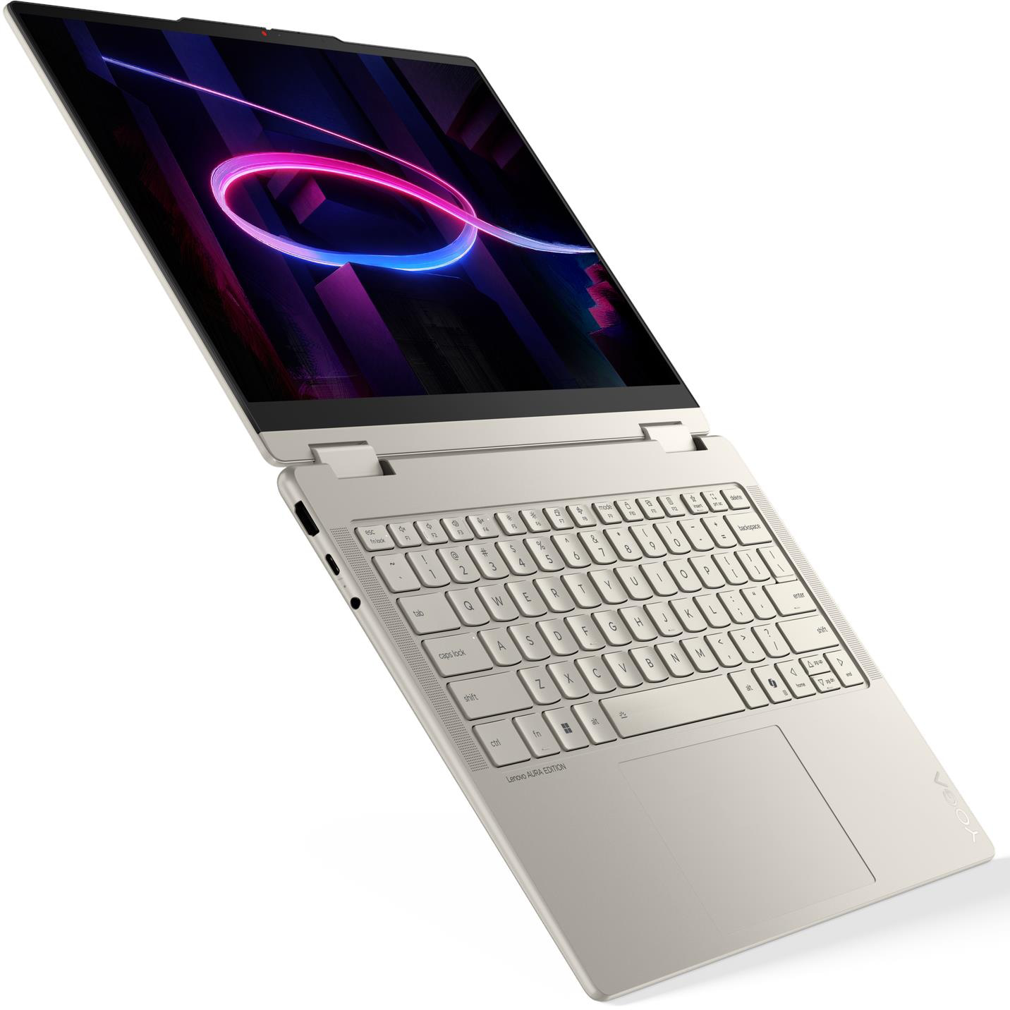Egy ezüst színű laptop nyitott képernyőjén izzó neon karikákat ábrázoló absztrakt kép látható.