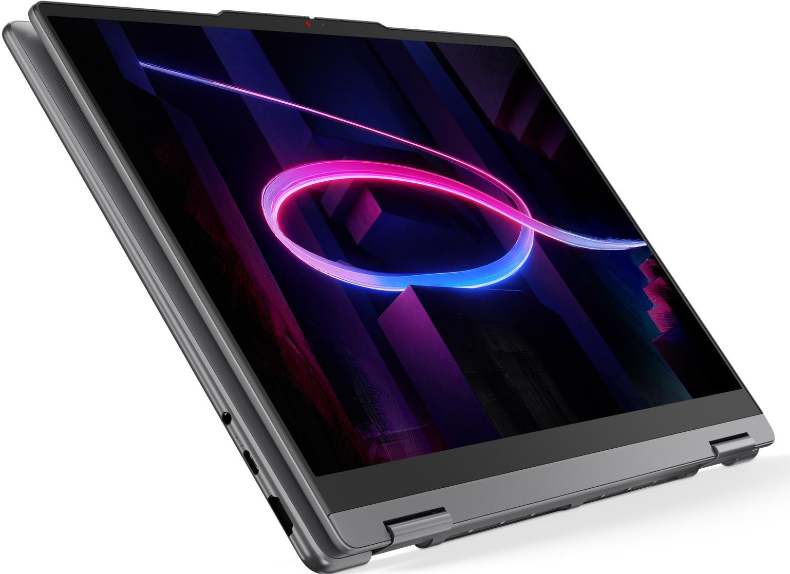 Egy szürke laptop nyitott képernyőjén egy színes, neonszerű kör alakú fény látható a háttérben.