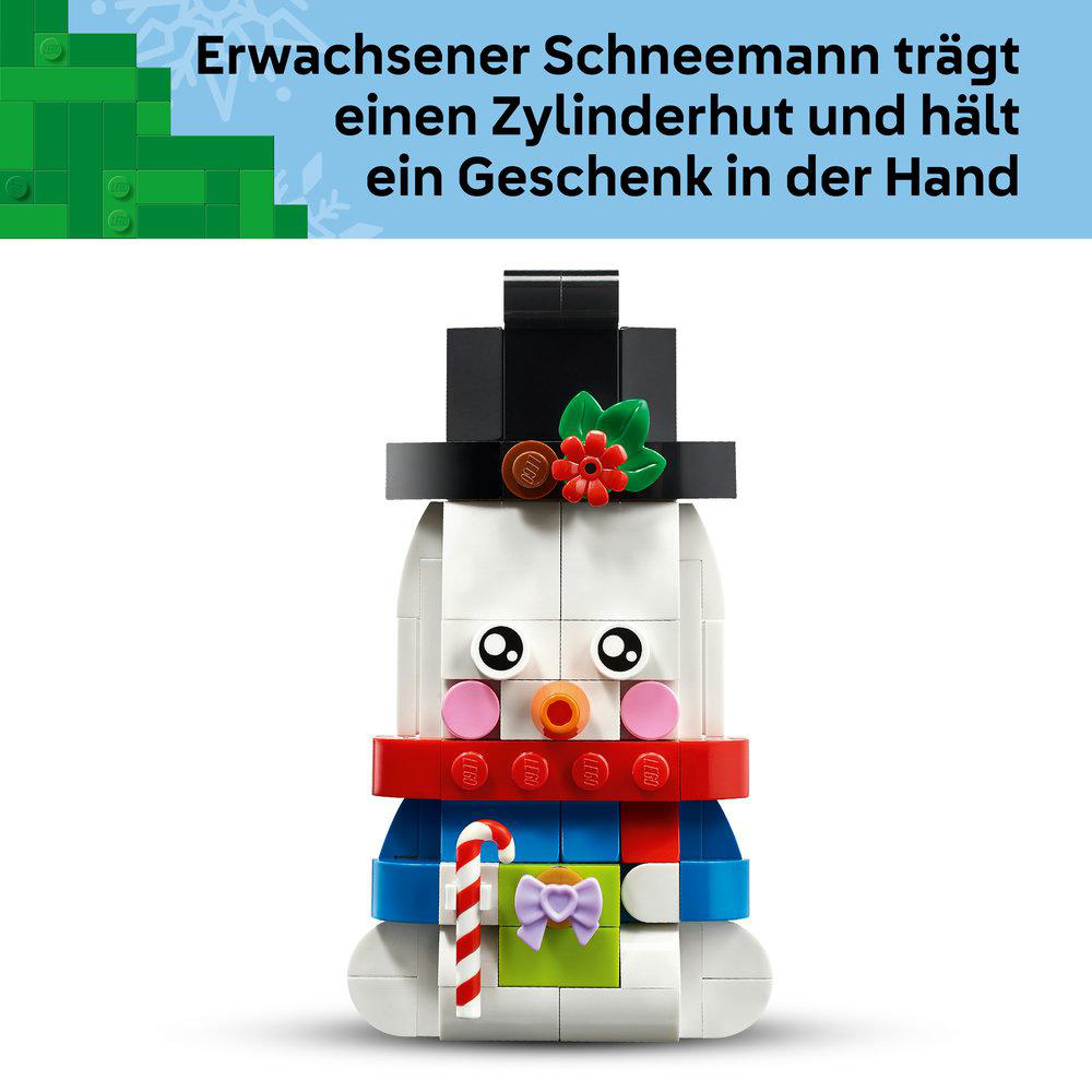 Lego-Schneemann mit Zylinder, Schal, Geschenk und Zuckerstange.
