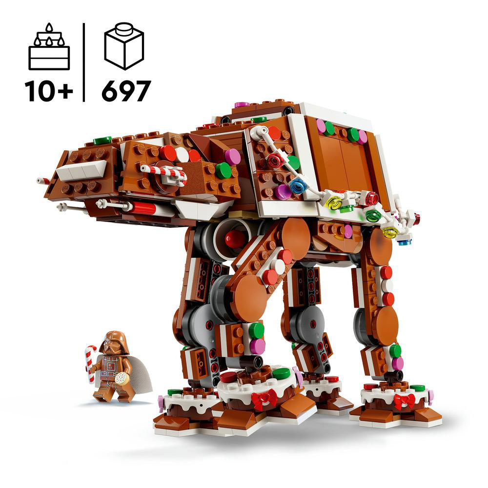Ein Lego Star Wars AT-AT im Lebkuchen-Design mit bunten Süßigkeiten, weißem Zuckerguss und einer Darth Vader Minifigur.