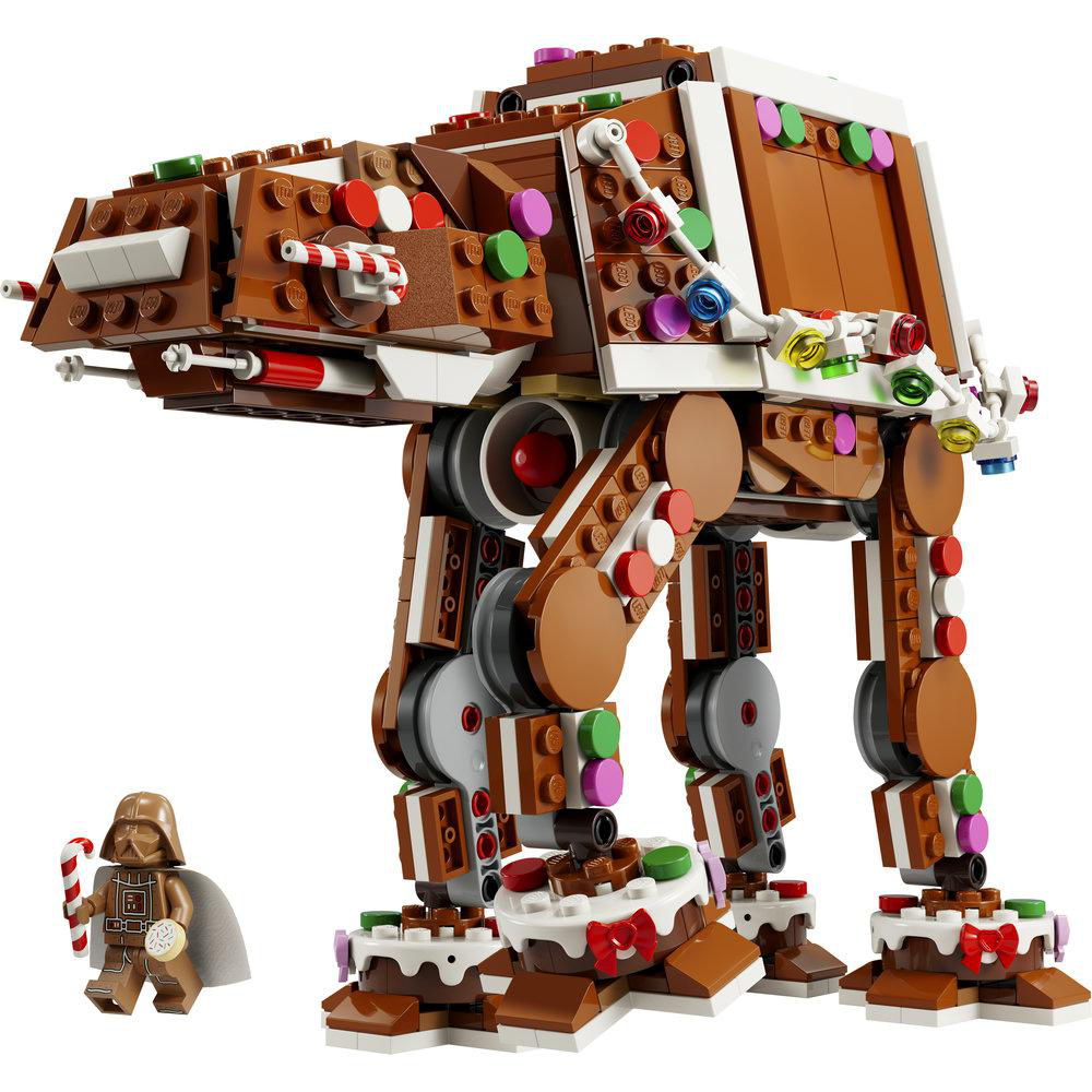 Ein Lego-Lebkuchen-AT-AT Walker mit bunten Süßigkeiten, weißem Zuckerguss und einer Darth Vader Minifigur in Lebkuchenoptik.