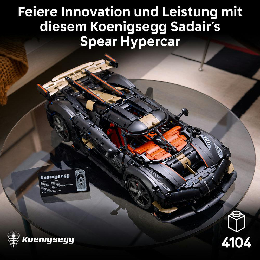 Ein detailreiches, schwarzes Lego-Technic-Hypercar steht auf einem gläsernen Tisch.