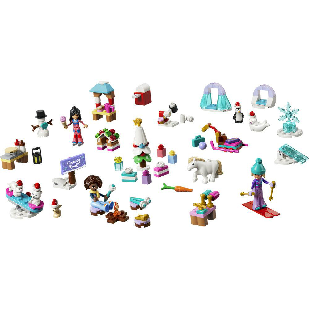 Lego-Winterset mit Minifiguren, Tieren, Schlitten, Weihnachtsbaum und Zubehörteilen auf weißem Hintergrund.