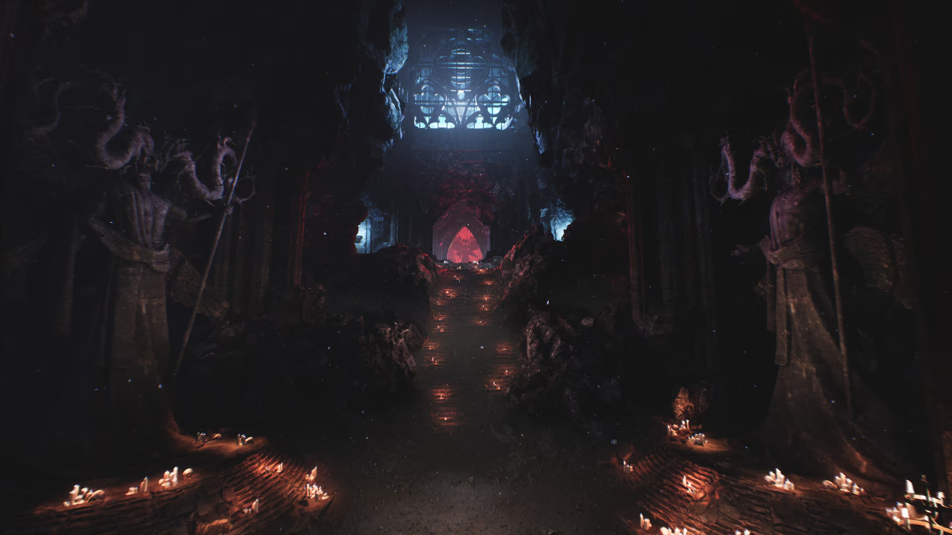 Scuro salone di pietra con grandi statue, candele accese, scale verso un arco rosso e finestra blu.