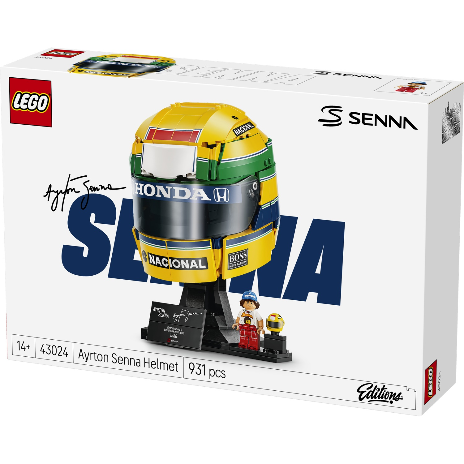 Lego set of Ayrton Senna's yellow, green, and blue helmet with display stand and minifigure on white box.