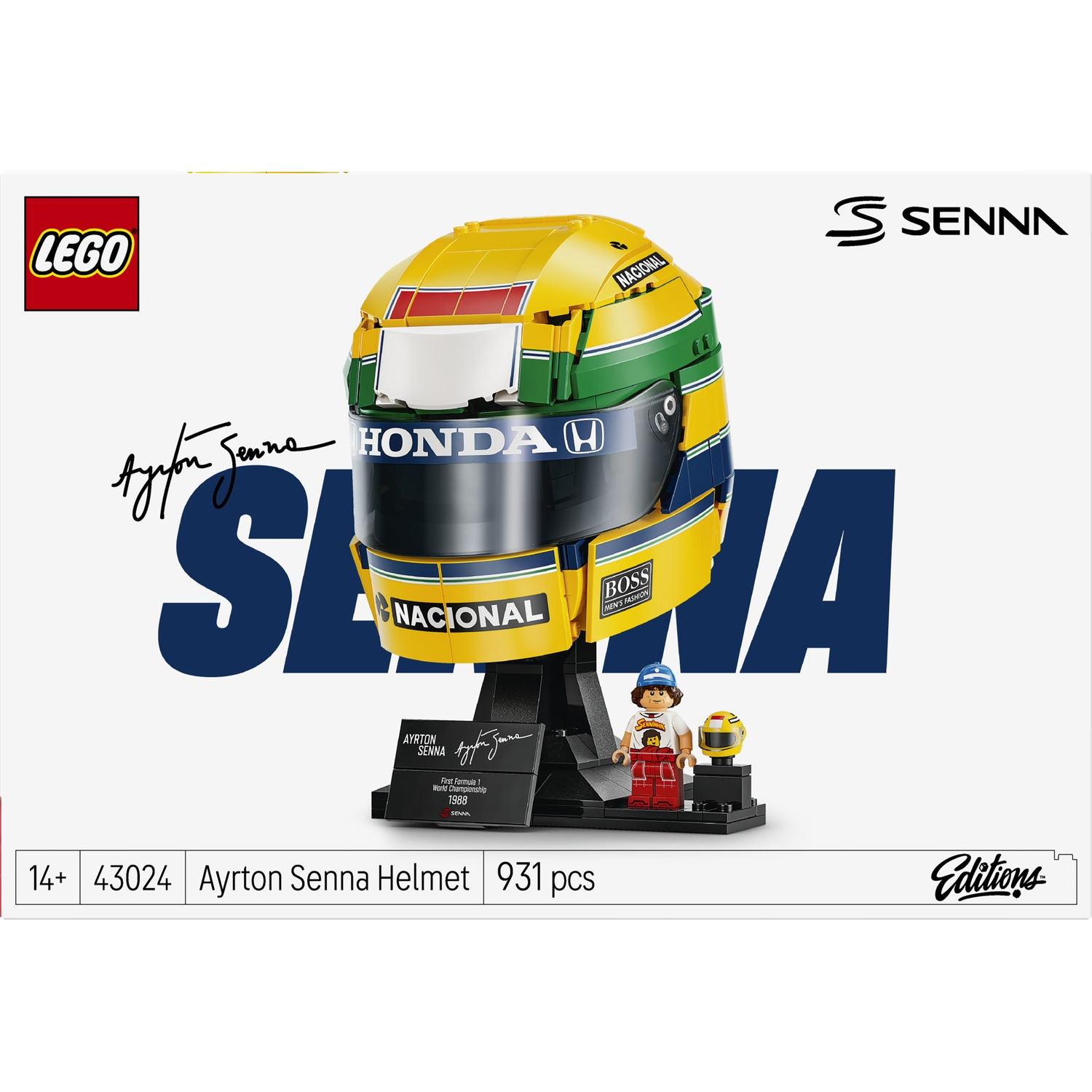 Lego Ayrton Senna helmet set with a black display stand, plaque, and small minifigure against a white box.