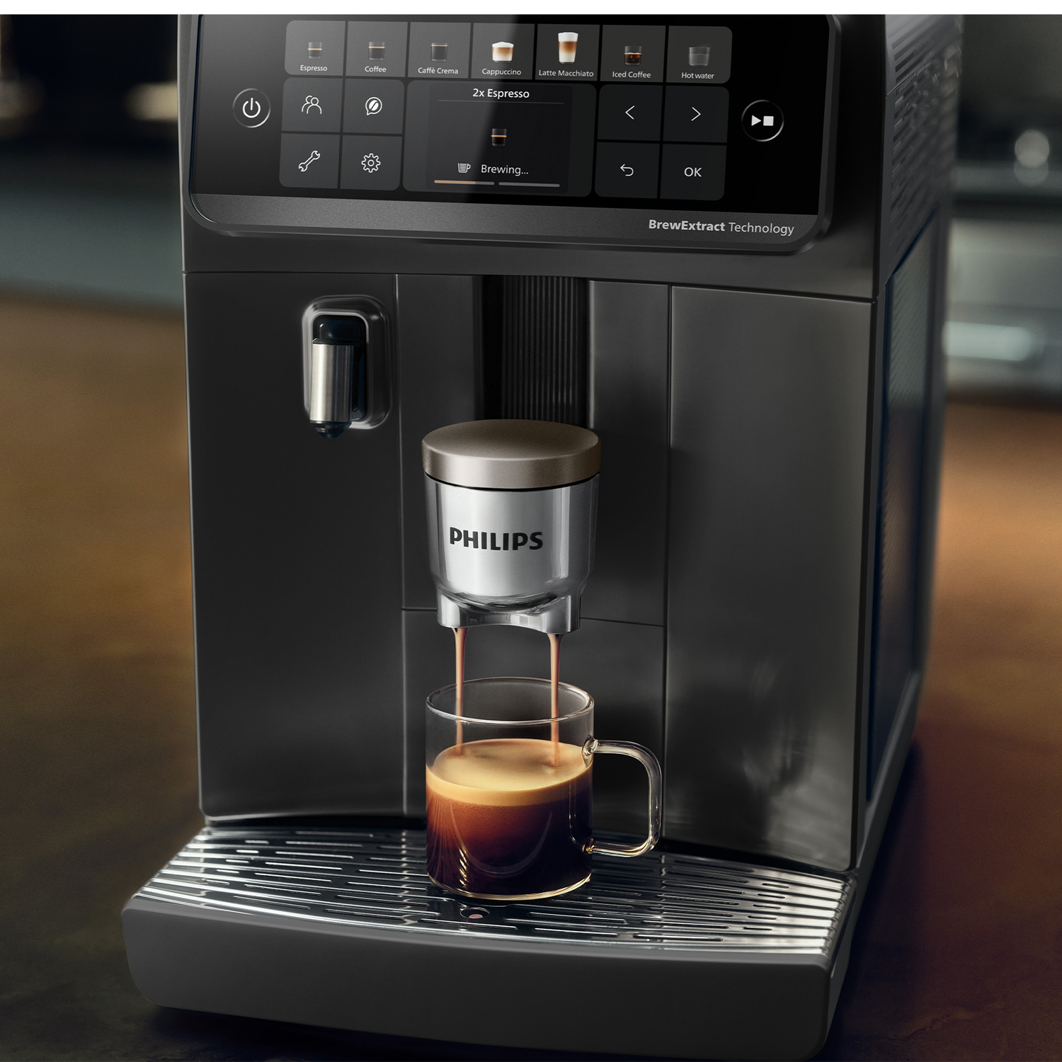 Modern black Philips coffee machine brewing a double espresso into a glass on the drip tray.